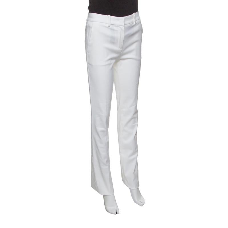 These pants from Roberto Cavalli are a great fusion of style and comfort. These white-hued, high waisted pants offer a straight fitting and are equipped with zip fastening on the front and four external pockets. We like them with floral printed tops