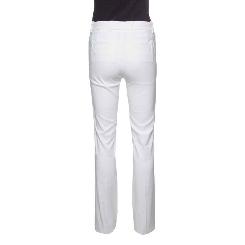 These pants from Roberto Cavalli are a great fusion of style and comfort. These white-hued, high waisted pants offer a straight fitting and are equipped with zip fastening on the front and four external pockets. We like them with floral printed tops