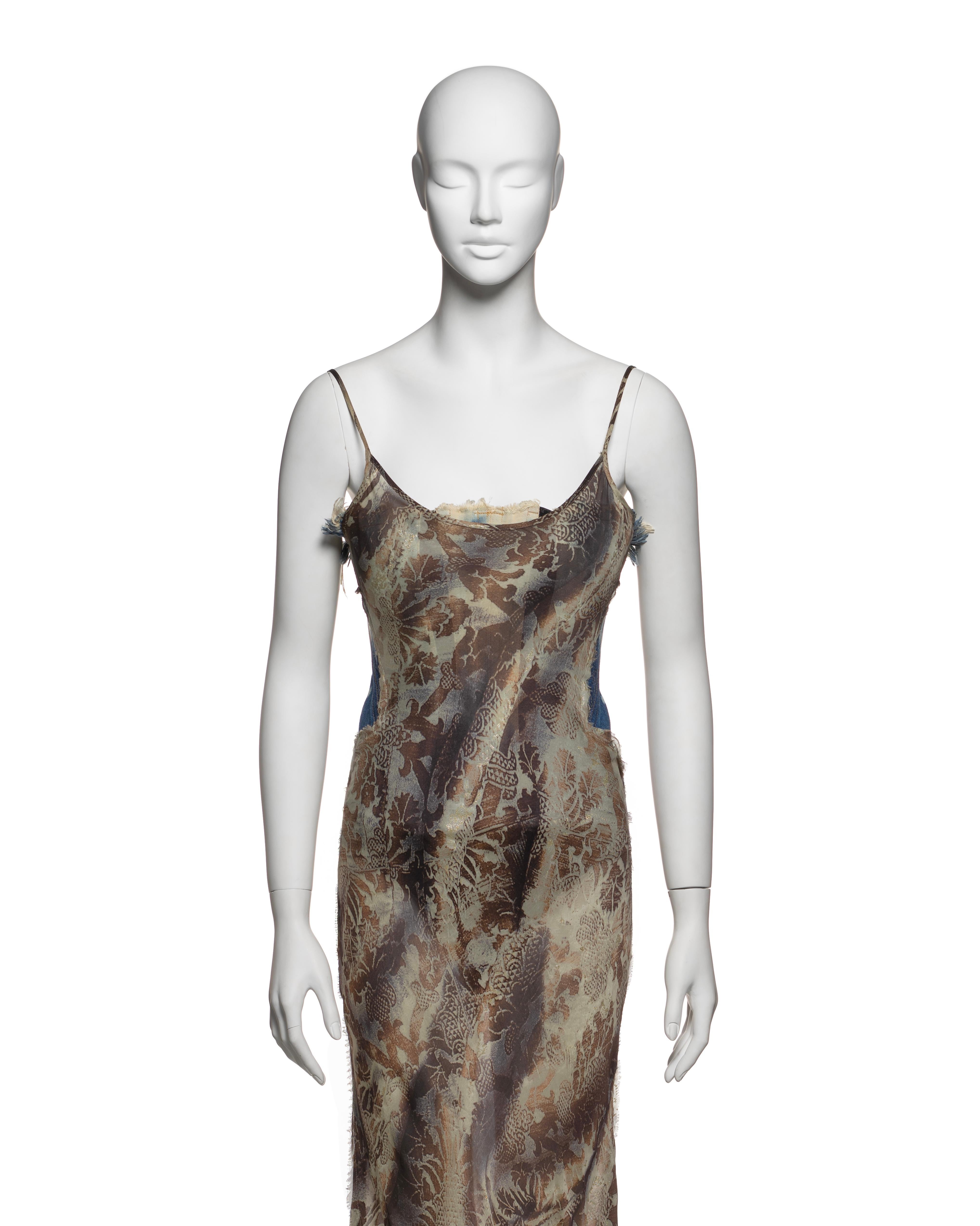 This rare Roberto Cavalli dress from the Fall-Winter 2001 collection features a bias-cut silk gown with a metallic brown and cream floral print, complemented by an integrated blue bleached denim corset, adding structural support and contrast. The