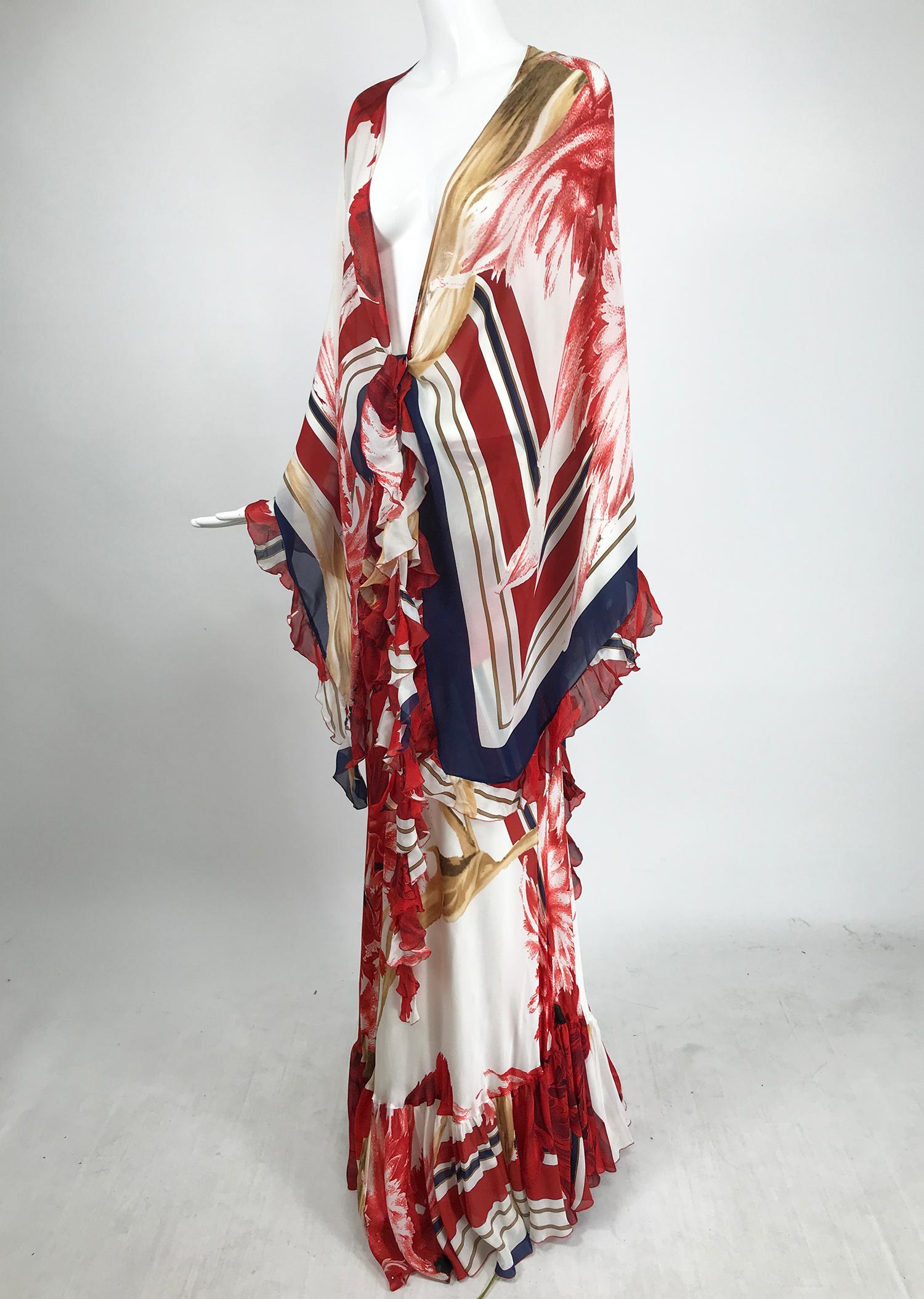 Roberto Cavalli silk maxi skirt and matching shawl in red, gold, white and blue. The shawl is a very large triangle. ruffle trimmed, with long ruffle trimmed ties at the front. The skirt is bias cut and full at the ruffle trimmed hem. The skirt is