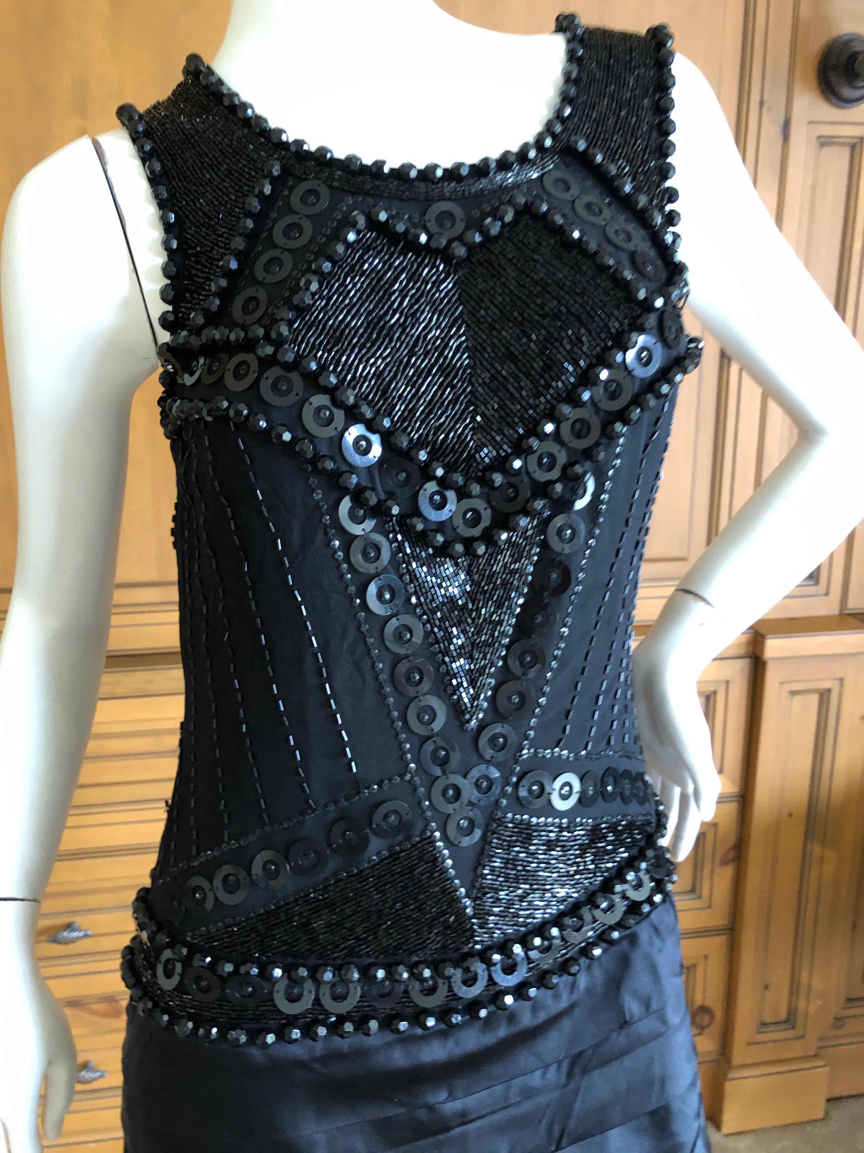 Roberto Cavalli for Just Cavalli Jet Embellished Vintage Black Silk Mini Dress.
This is amazing, the faceted jet beads are glass, wonderful tactile movement with this.
Size 40
Bust 35