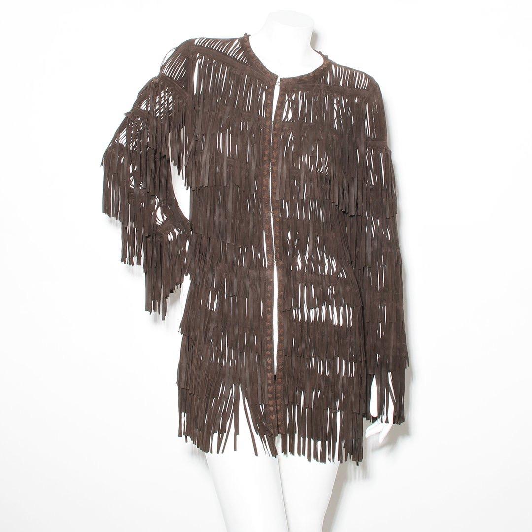 Product Details:
Fringe jacket by Roberto Cavalli 
Circa 2005
Brown leather
Fringe details throughout 
Long sleeve 
Hook and eye front closure 
Knotted leather trim 
Made in Italy
Condition: Excellent. little to no visible wear. leather lightly worn