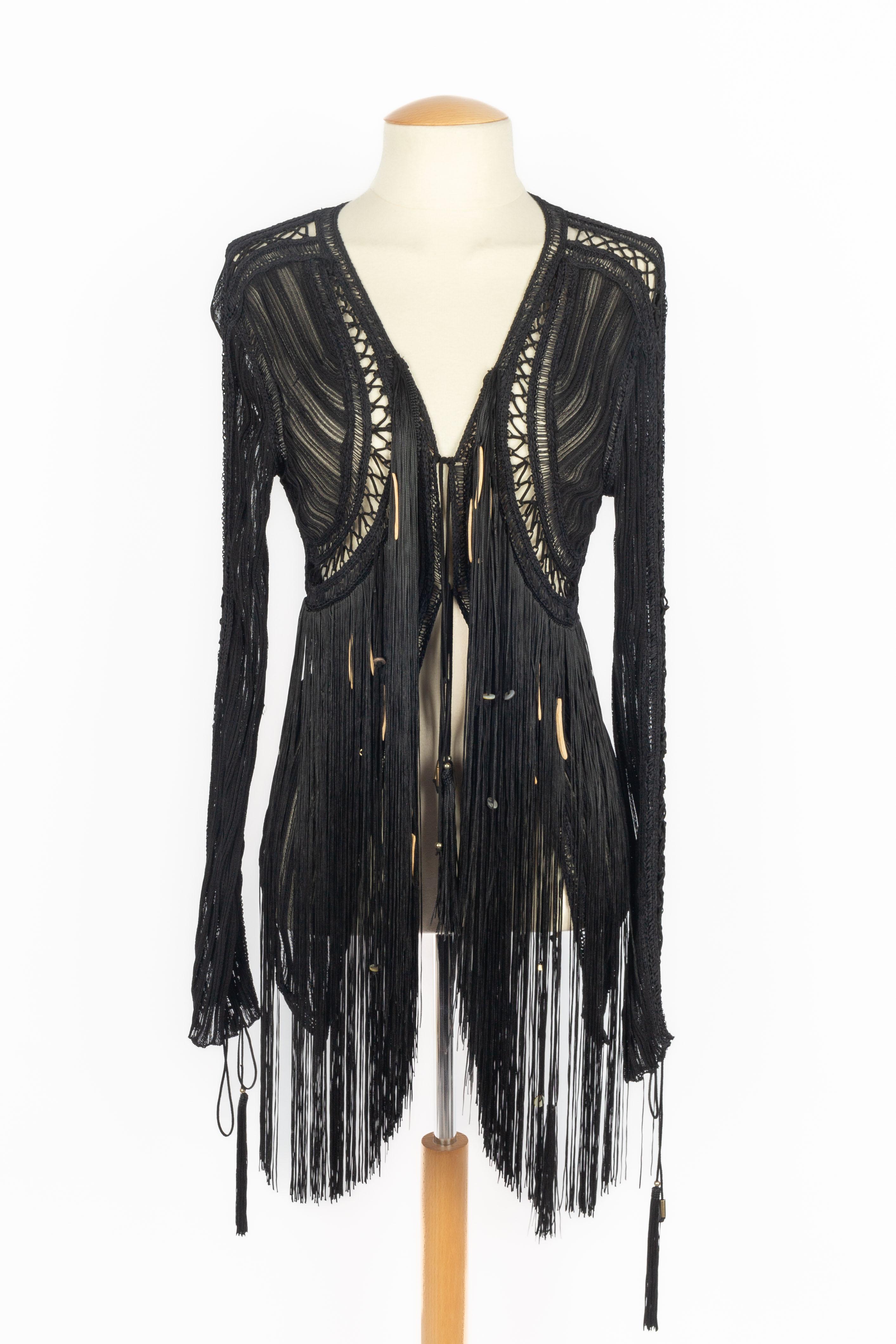 CAVALLI - (Made in Italy) Black viscose mesh jacket / cardigan with long sleeves, ornamented with fringes, suede laces, and pearls. Size 42IT.

Condition:
Very good condition

Dimensions:
Shoulder width: - Chest: - Sleeve length: - Length:

SKU:FH46
