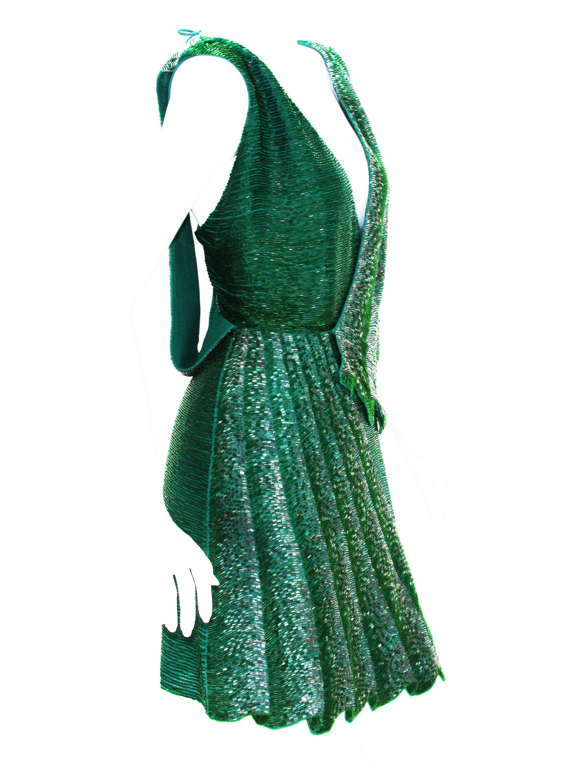 Roberto Cavalli Fully Beaded Drape Illusion Mini Dress
Designer size - 40
100% Silk, Fully Hand Beaded in Green and Graphite Beads in Drape Illusion Look, Deep Plunging, Fully Lined.
Measurements: Length - 33 inches, Bust - 30/32