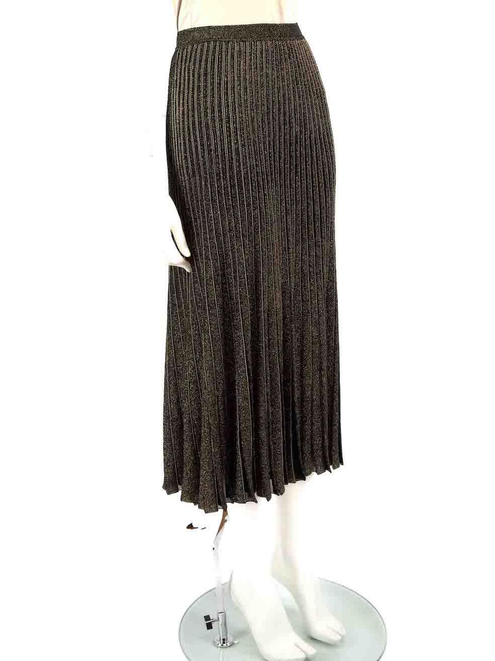 CONDITION is Very good. Hardly any visible wear to skirt is evident on this used Roberto Cavalli designer resale item.
 
 
 
 Details
 
 
 Gold metallic
 
 Viscose
 
 Pleated knit skirt
 
 Gold thread
 
 Midi
 
 Elasticated waistband
 
 
 
 
 
 Made