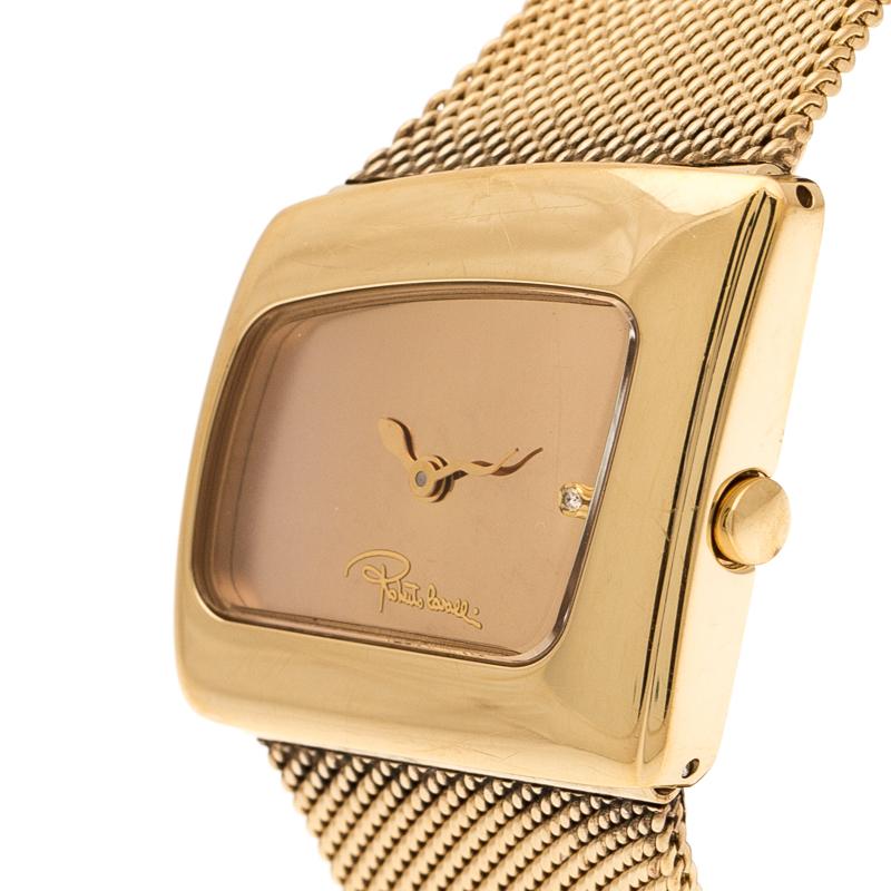 Unique and fabulous, this Roberto Cavalli wristwatch is subtly wild with a futuristic aesthetic. Made from gold-plated stainless steel, it brings an asymmetric case with a dial fixed with snake hands and a sparkling stone. This quartz wristwatch has