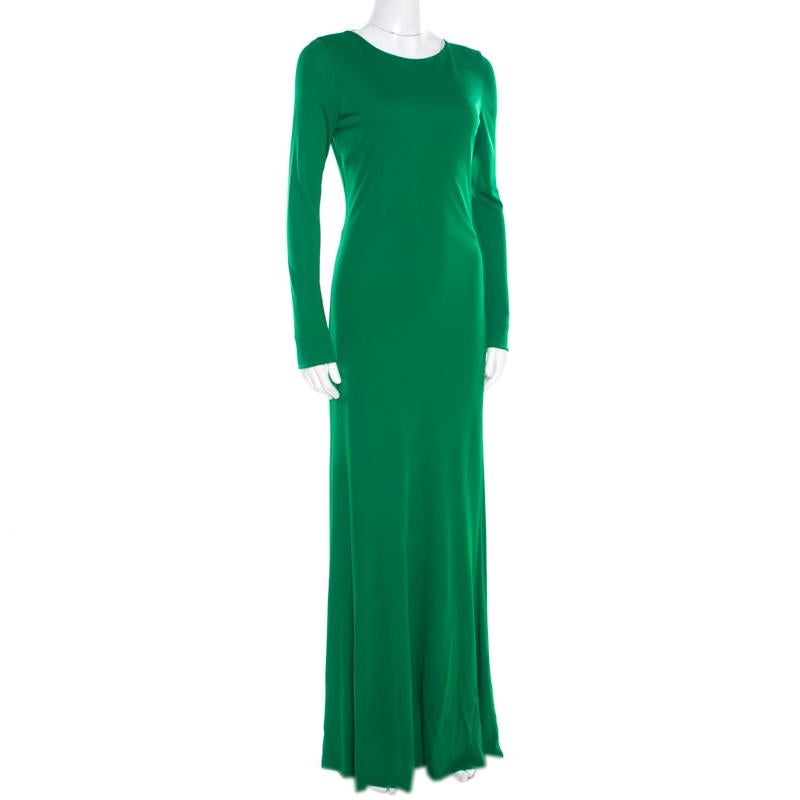 Roberto Cavalli design their elegant evening wears with subtle hints of glamor. This amazing green gown is styled with a simple round neckline and a zip closure at the rear to give you a flattering shape. It is designed with long sleeves and a