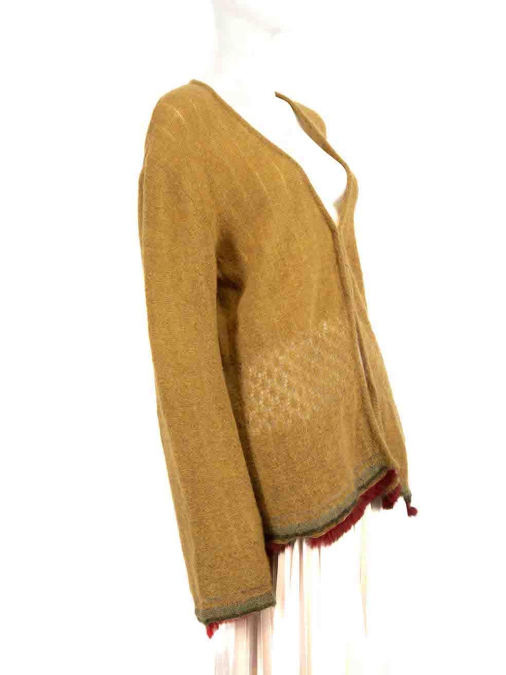 CONDITION is Very good. Hardly any visible wear to cardigan is evident on this used Roberto Cavalli designer resale item.
 
 Details
 Green
 Wool
 Knit cardigan
 Red fur trim
 V-neck
 Hook fastening
 Long sleeves
 
 
 Made in Italy
 
 Composition
