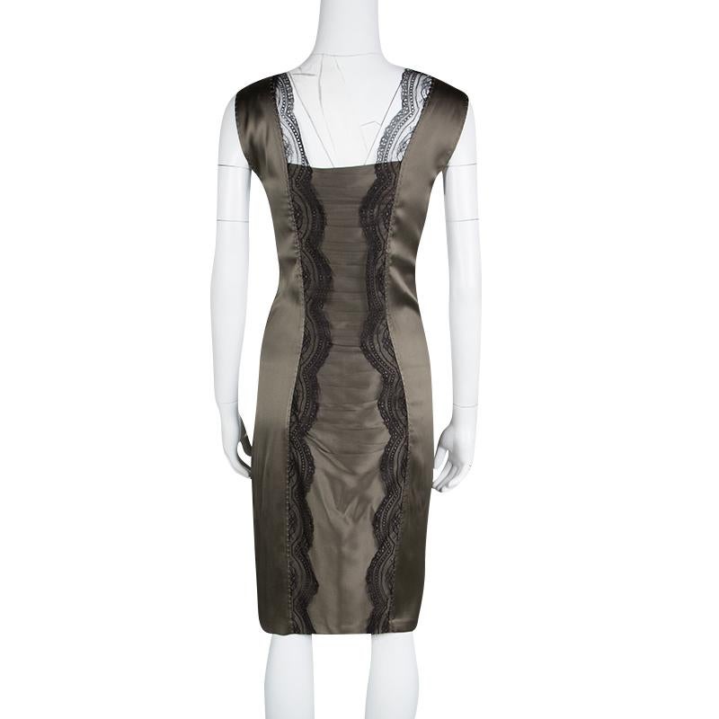 Chic and lovely in appeal, this beige satin dress from Roberto Cavalli is worth a buy. It has been finely cut styled as a sleeveless with intricate lace pattern moving parallel from top to bottom on each side making you look slimmer and sexier. The