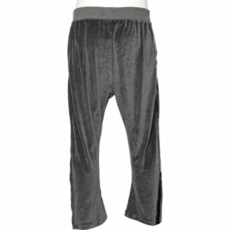 Spend the day comfortably and stylishly with these track pants from the House of Roberto Cavalli. They are made from grey velvet fabric and feature a tie detail on the waistline. They have two external pockets.