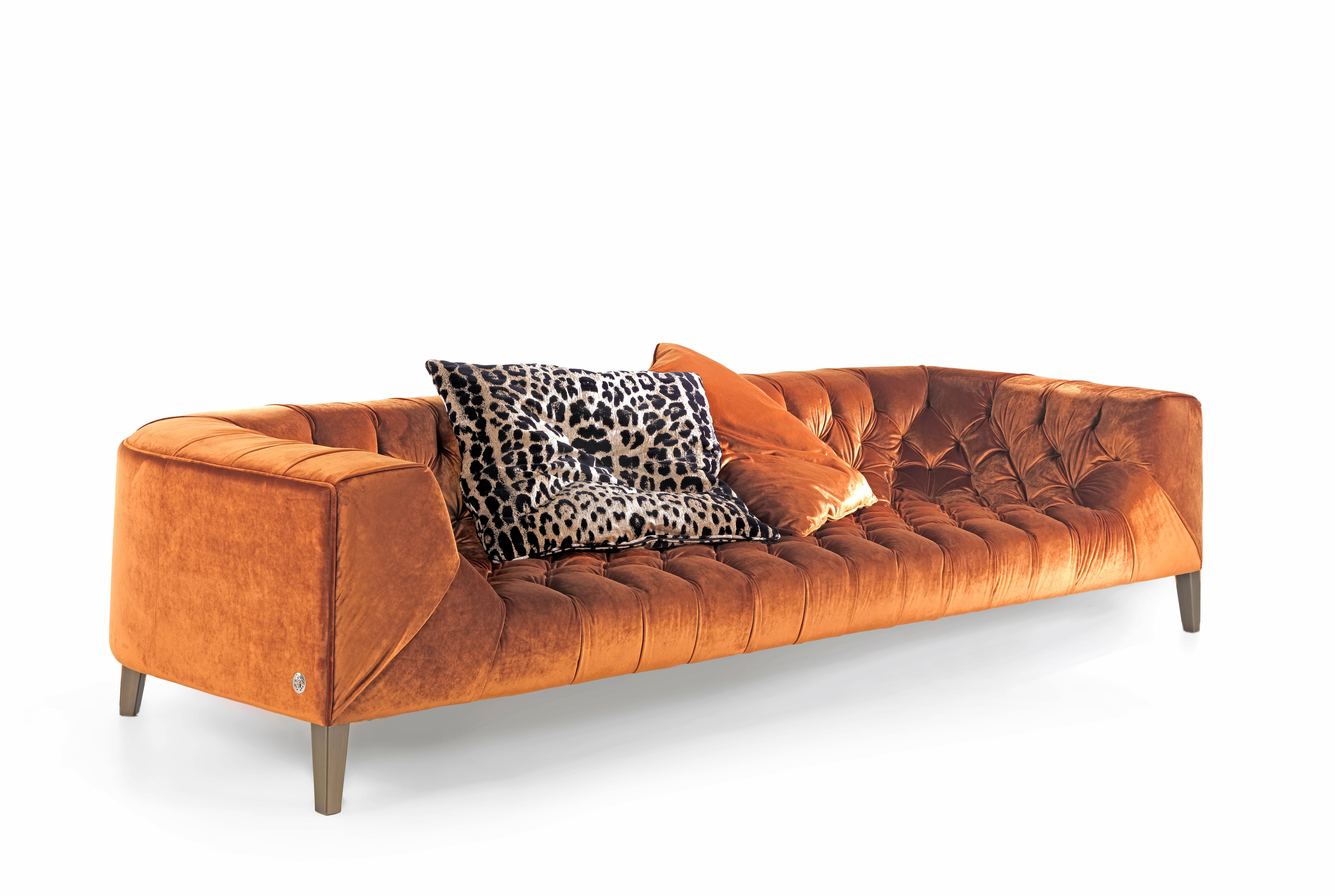 Blake 4-seater sofa structure in poplar wood and foam. Upholstery in fabric CAT. A Velvet Paul COL. 403 Orange. Metal feet in brushed bronze finishing. Additional decorative cushions upon request.  