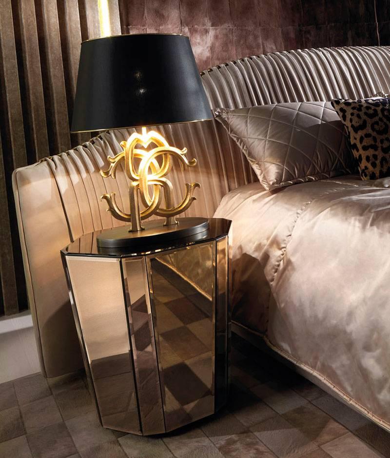 Night table with multi-layer wood structure. Bevelled mirrors in bronze finishes. Sand-blasted Roberto Cavalli logo on top.
