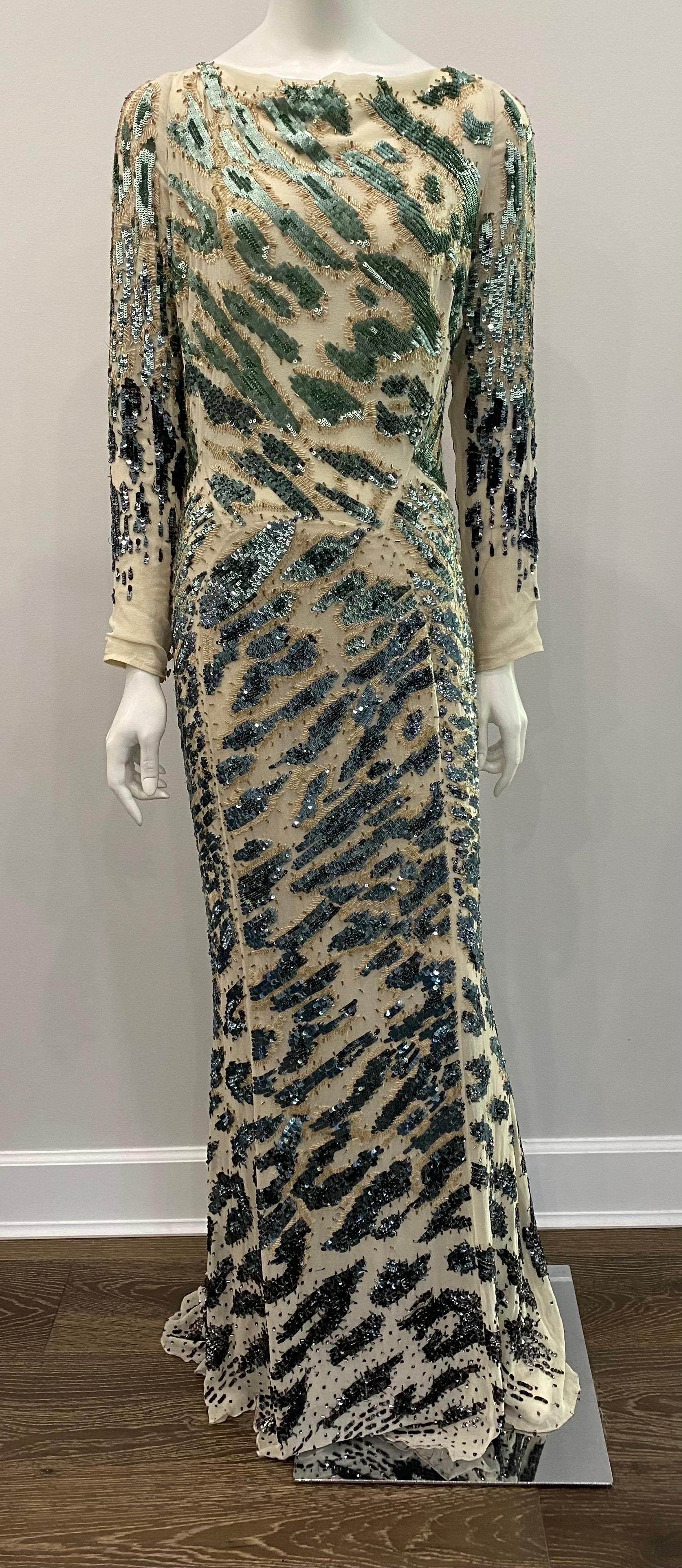 Roberto Cavalli Ivory Silk Chiffon gown with Green and Tan sequin/bugle beads - Sz 44 This gorgeous gown has long sleeves, an low plunging v neck open back with a ivory ribbon tie across the shoulders to help keep gown on the shoulders. The gown is