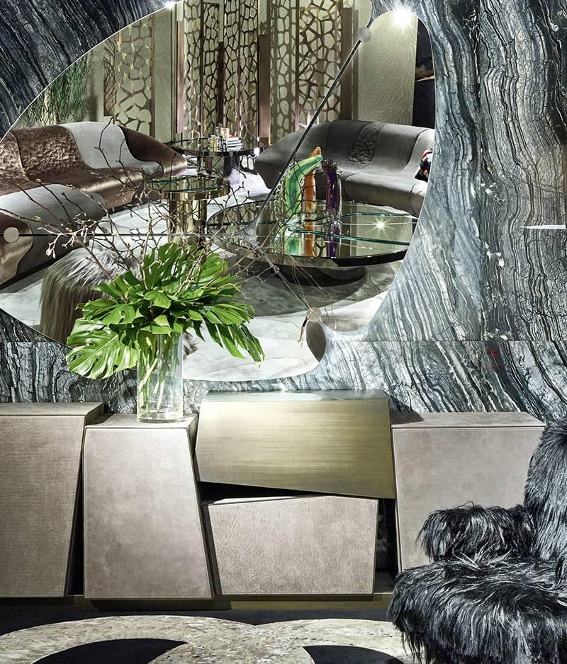 Multi-layer wood sideboard. Upholstery in daino and fumè nabuk leather. Metal parts in brushed dark bronze finishes.