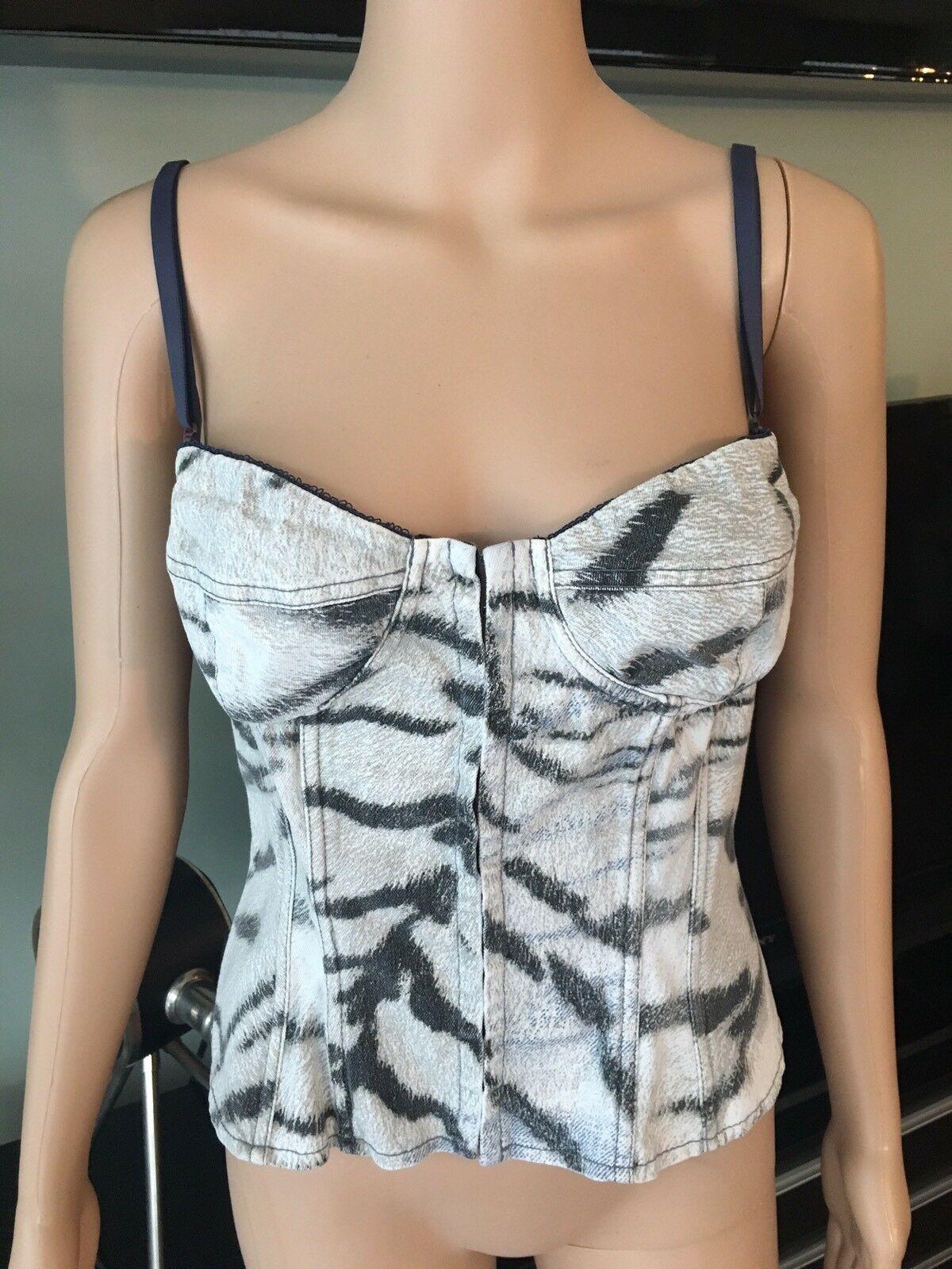 Ivory, black and medium wash blue Just Cavalli sleeveless animal print denim bustier top with sweetheart neckline, boned bodice, detachable shoulder straps and hook-and-eye closures at front. Size tag removed, estimated from measurements.

