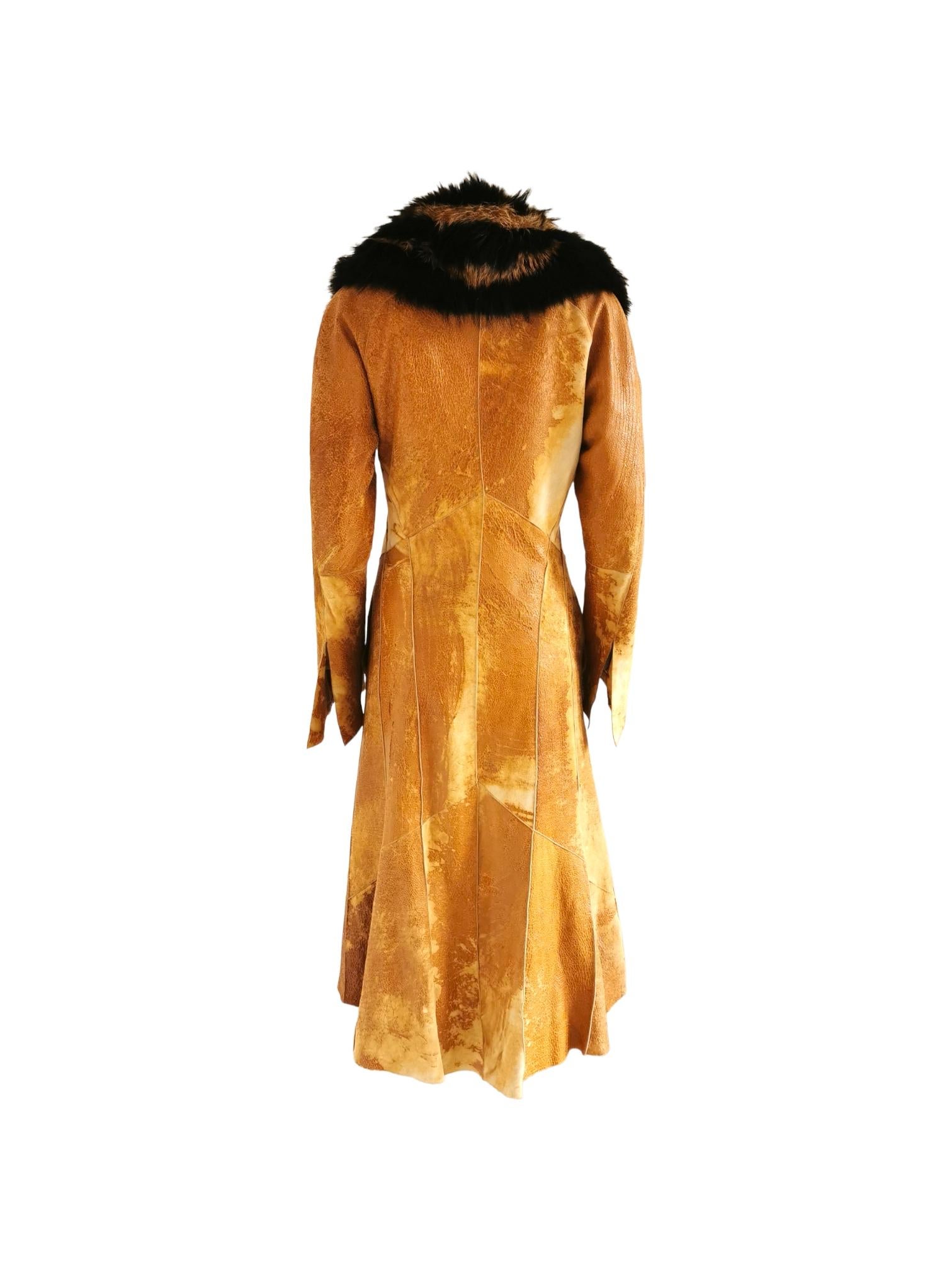 MY Runway Archive presents this beautiful and rare Roberto Cavalli leather coat with fur collar and silk patchwork print lining from the FW 2002 collection.

Material: Outer - leather; Collar - fur; Lining - silk

Condition: Very good. Please note