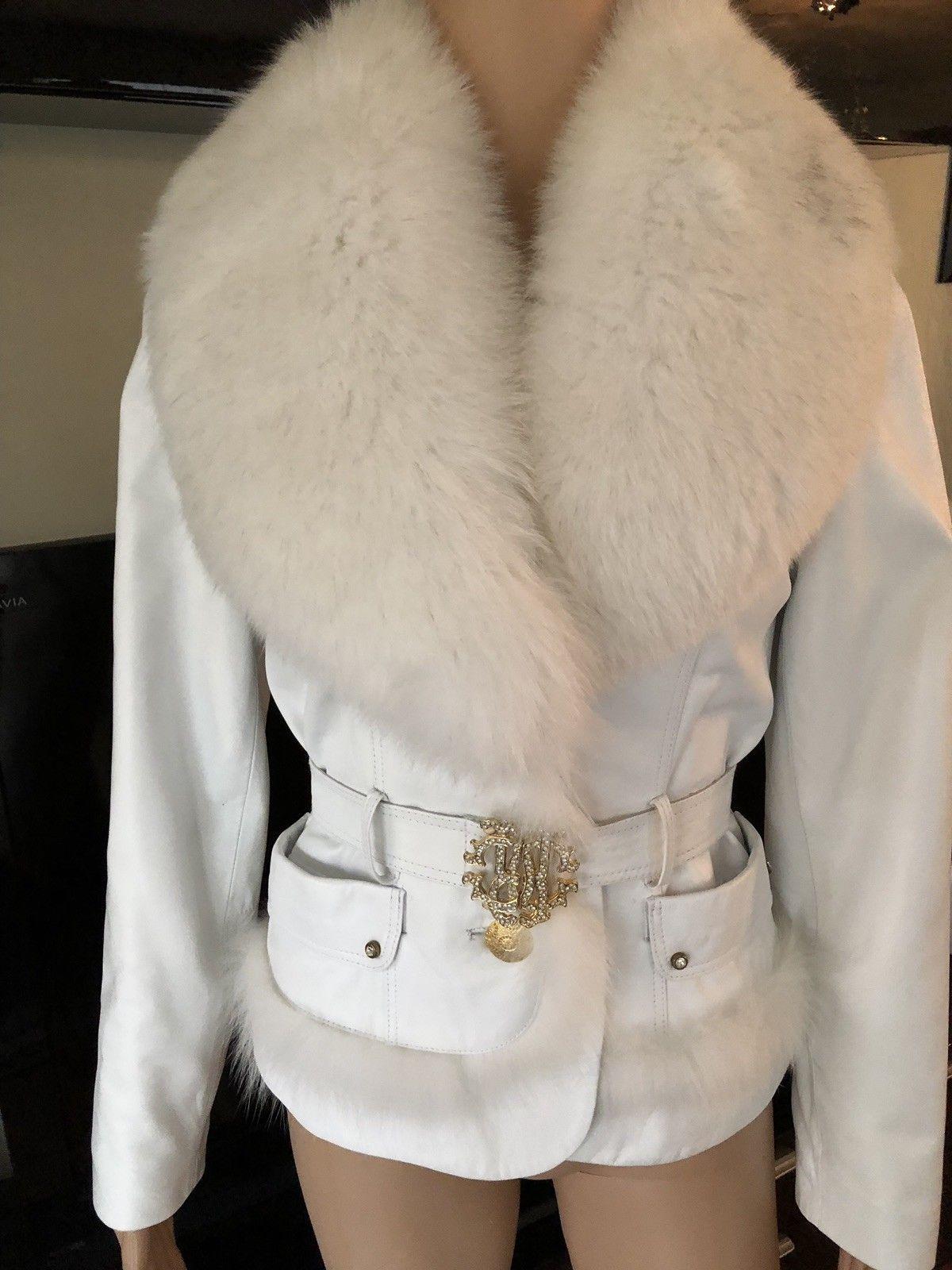 Roberto Cavalli Leather Fur Trimmed Embellished Logo Belt Jacket Coat 

White Roberto Cavalli leather coat with fur collar, belt, dual pockets and button closures at front.

