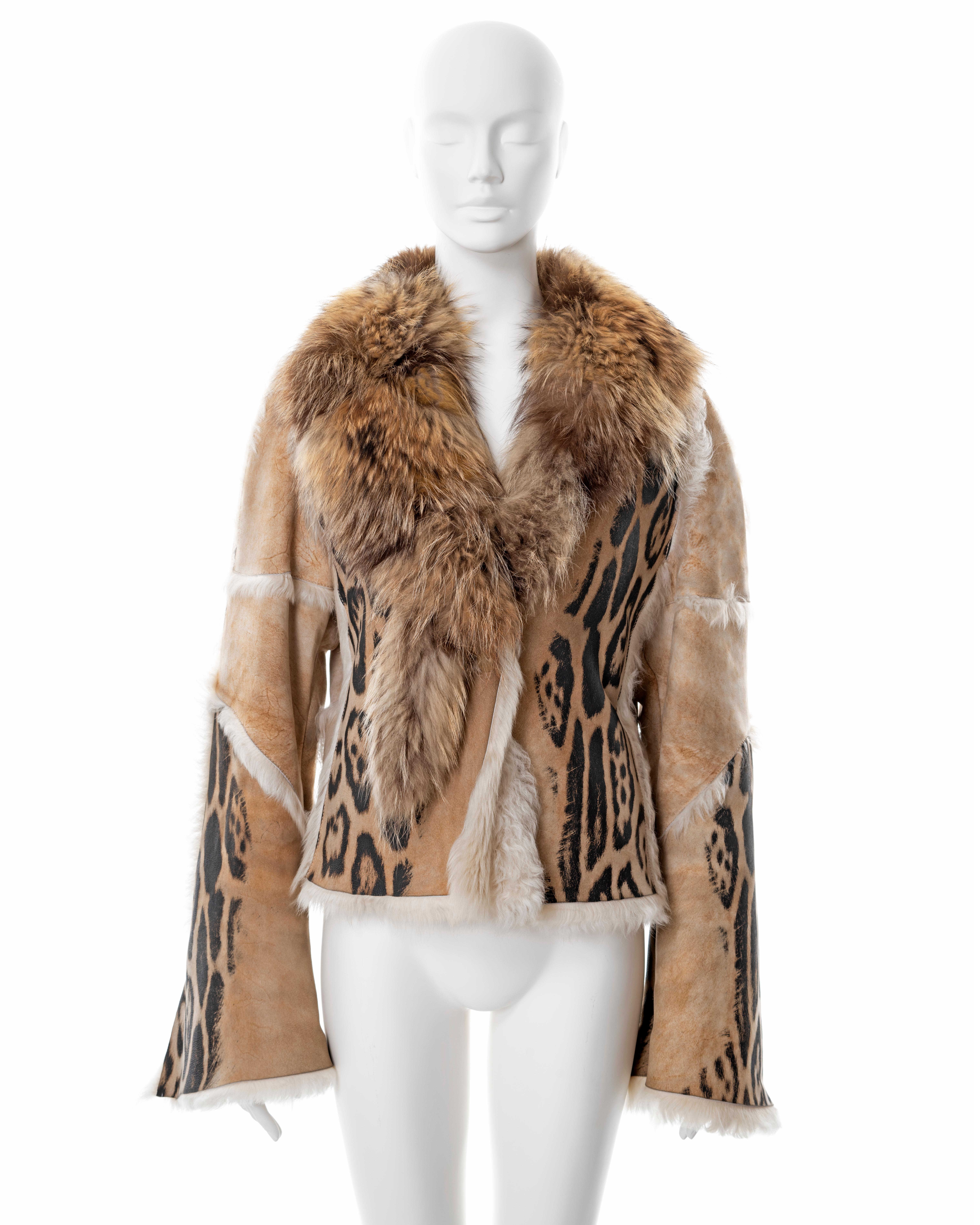 ▪ Roberto Cavalli sheepskin jacket
▪ Sold by One of a Kind Archive 
▪ Fall-Winter 2001
▪ Constructed from cream sheepskin with black leopard print 
▪ Fox fur collar 
▪ Long flared sleeves 
▪ Size Large
▪ Made in Italy 

All photographs in this