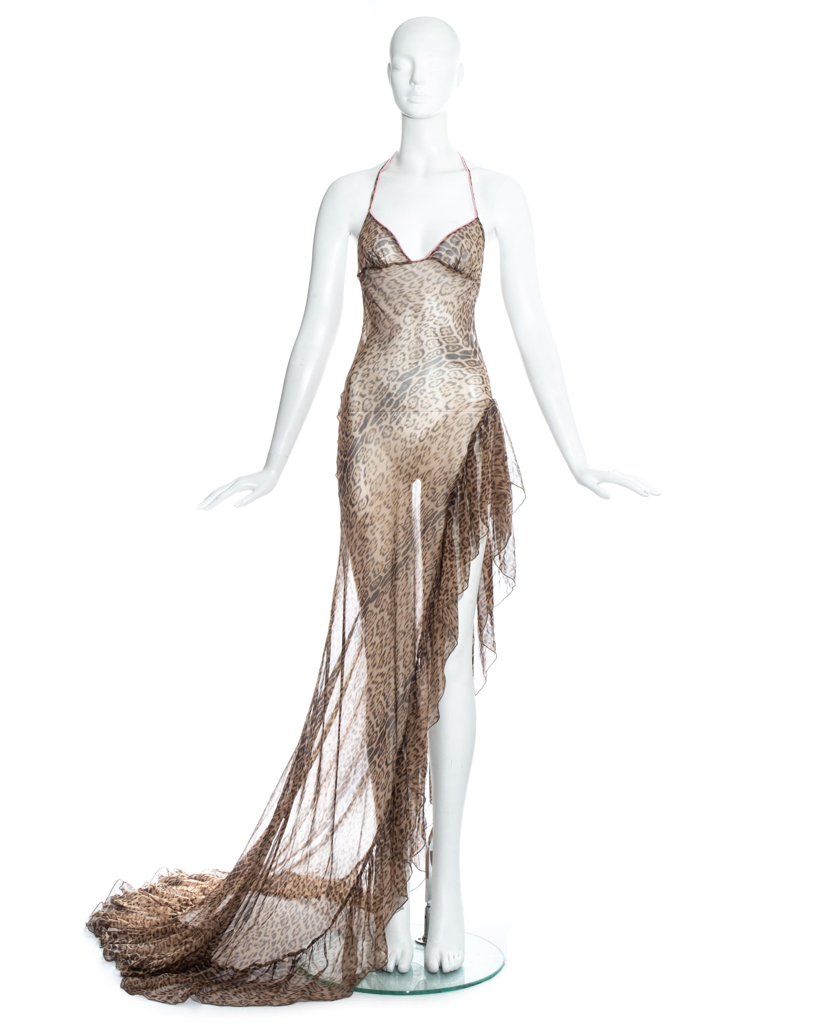 Early 2000s Roberto Cavalli evening dress. Leopard printed silk chiffon, beaded string halter neck and high leg slit with ruffled trim. 

