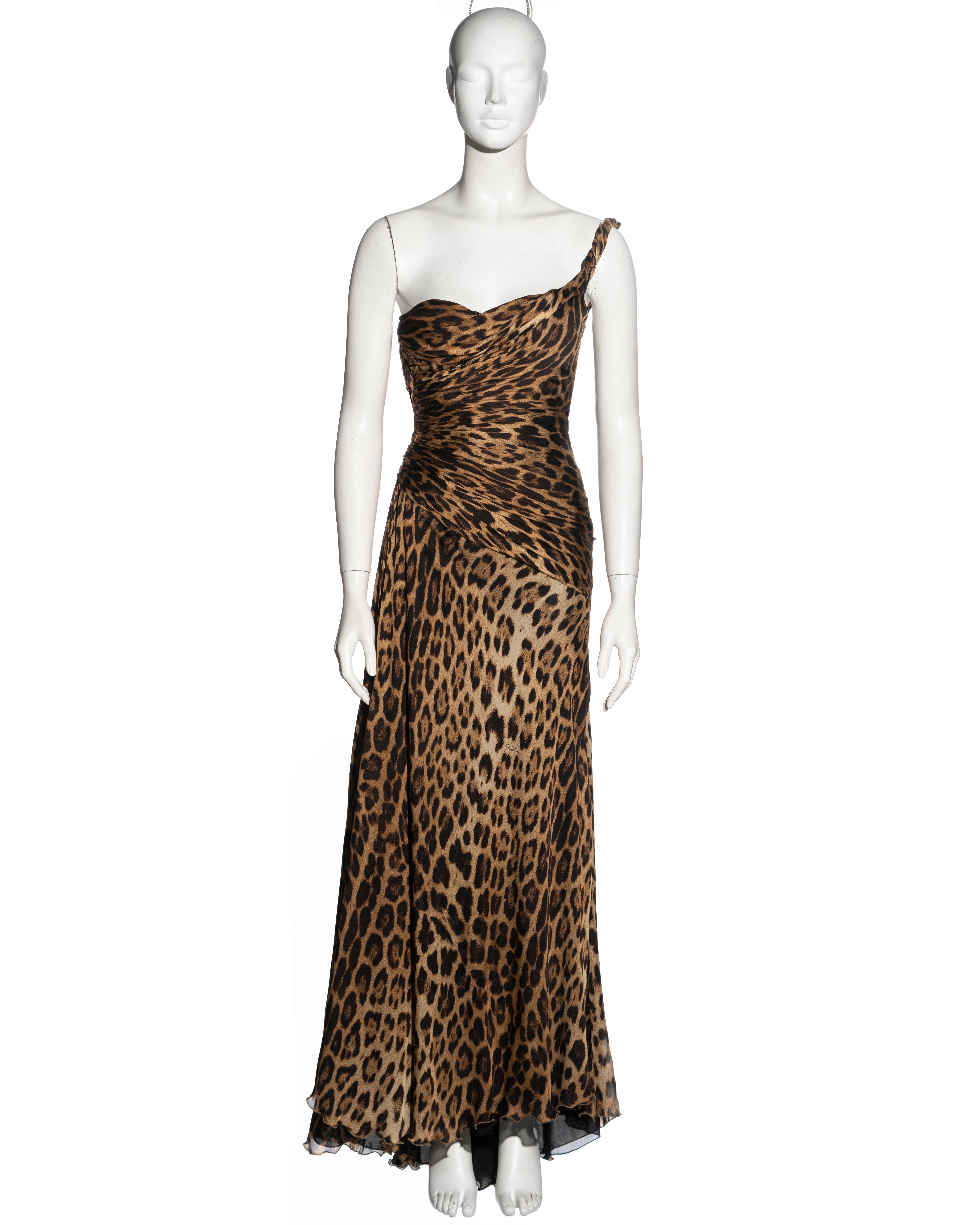 ▪ Roberto Cavalli evening dress
▪ Sold by One of a Kind Archive
▪ Constructed from leopard printed silk 
▪ Bulit-in corset bodysuit 
▪ Pleated bodice with asymmetric draped neckline 
▪ One shoulder strap 
▪ Floor-length skirt with leg slit 
▪ Size: