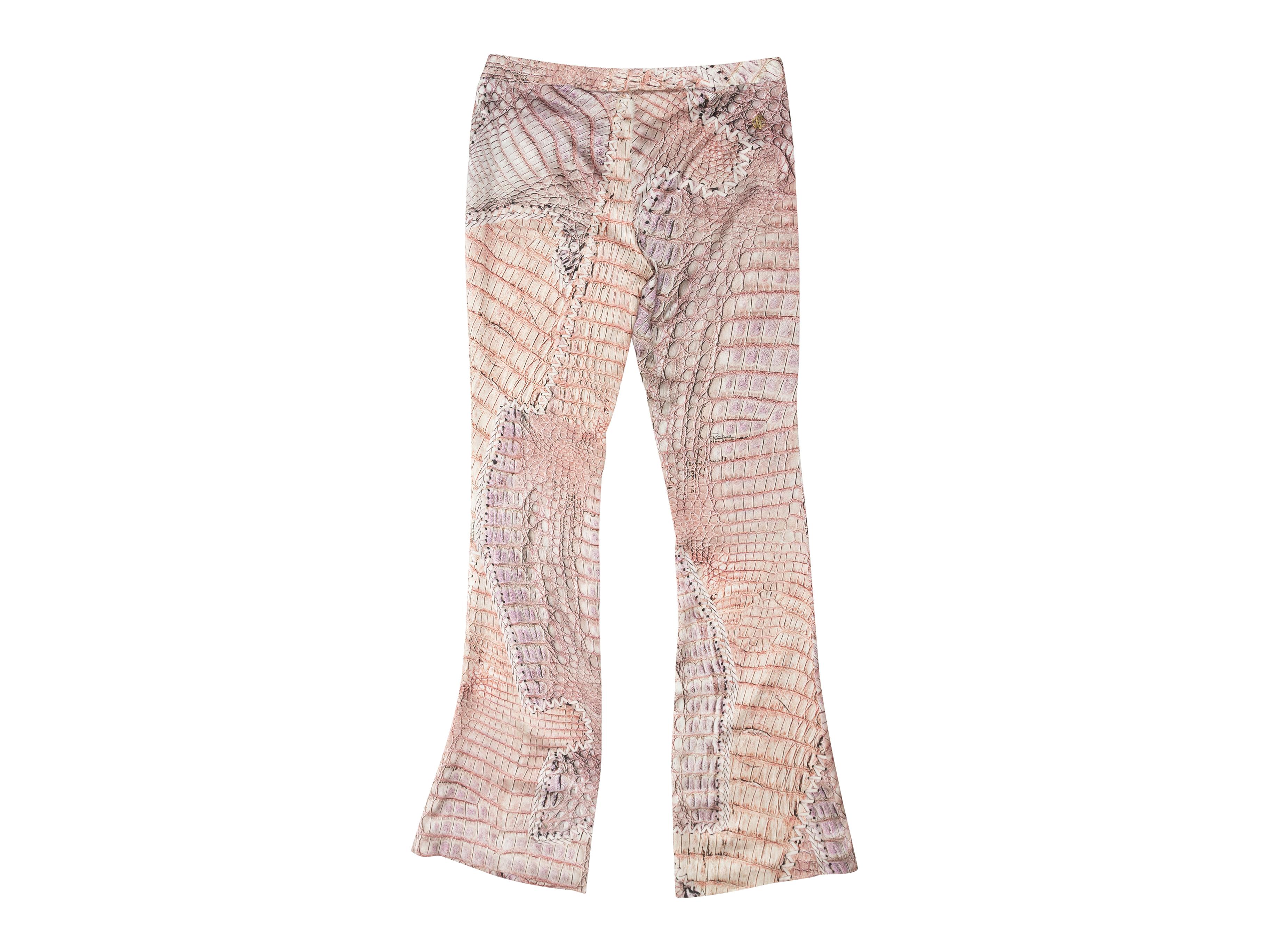 Product details: Light pink silk pants by Roberto Cavalli. Alligator skin print throughout. Closure at front. Designer size 40. 30