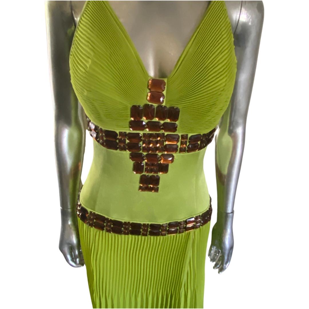 The color! This halter dress is the most beautiful shade if lime and looks amazing with topaz brown stones hand-beaded on the dress.The dress is pleated chiffon on bodice and skirt. Below the bust and beading is made with a charmeuse fabric to