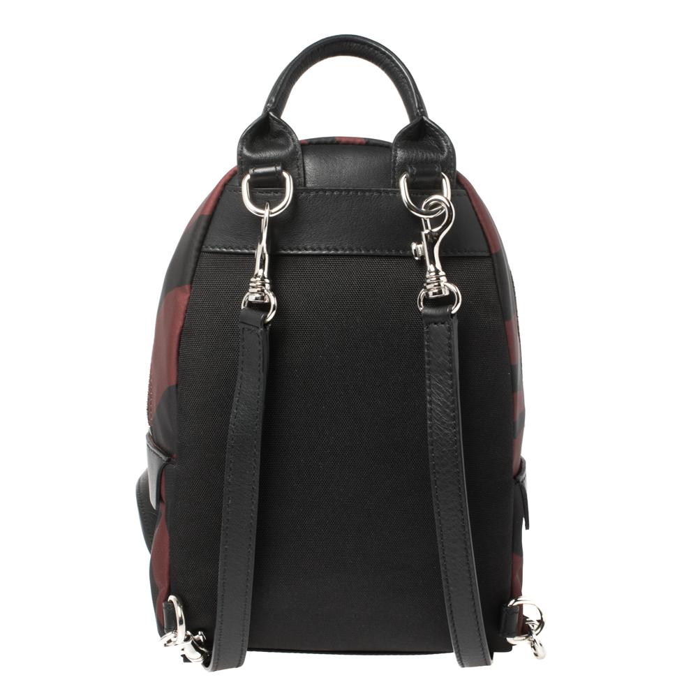 Totally chic and very stylish, this Roberto Cavalli backpack is sure to make you stand out. It is crafted from fabric & leather and features a zebra print along with the brand logo details. It has a silver-tone zip closure that opens to a spacious