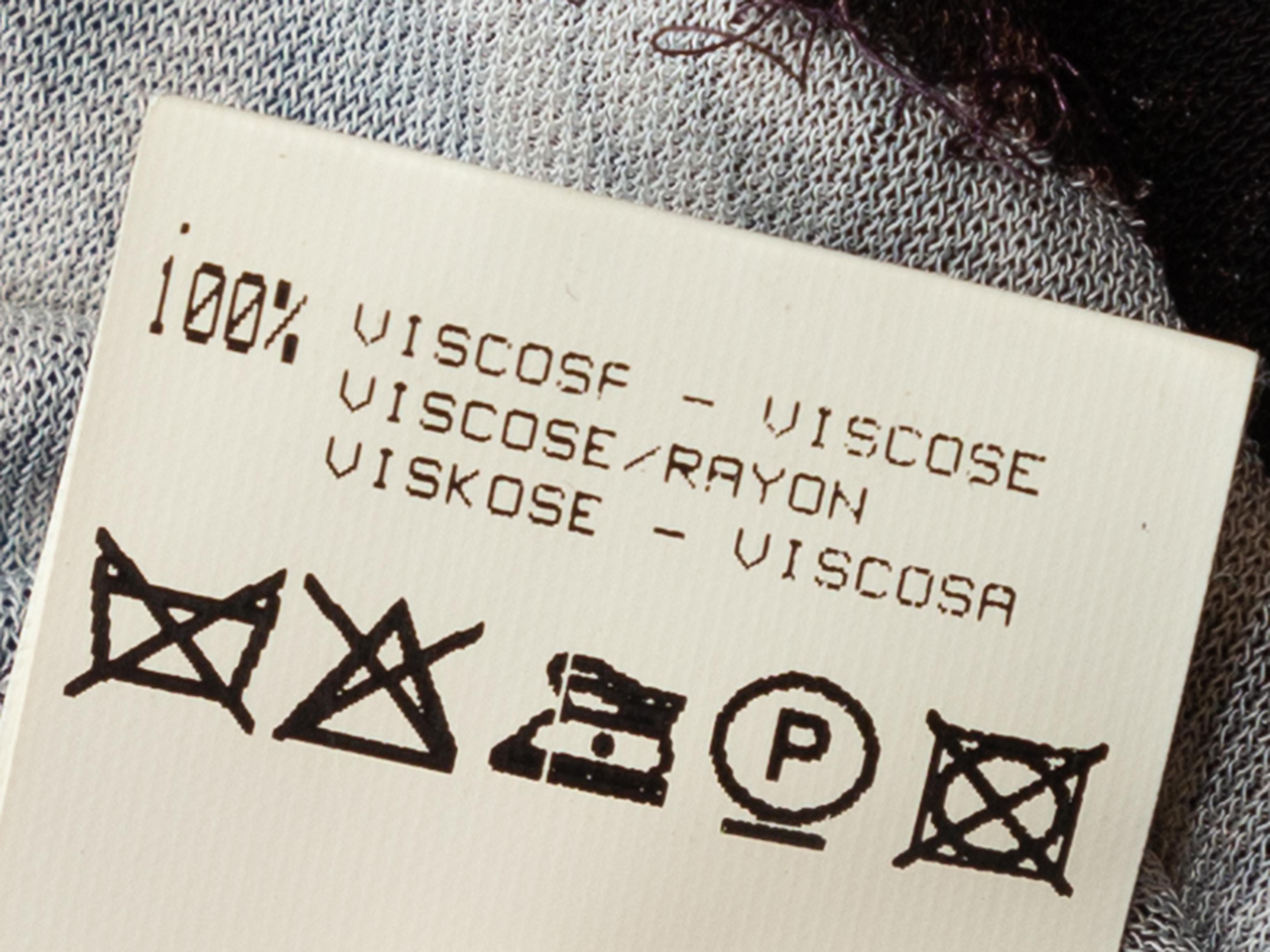 Product details: Mauve and black bodycon snakeskin print halter dress by Roberto Cavalli. V-neck. Gold-tone metal snake adornment at bust. Zip closure at back. Designer size 40. 27