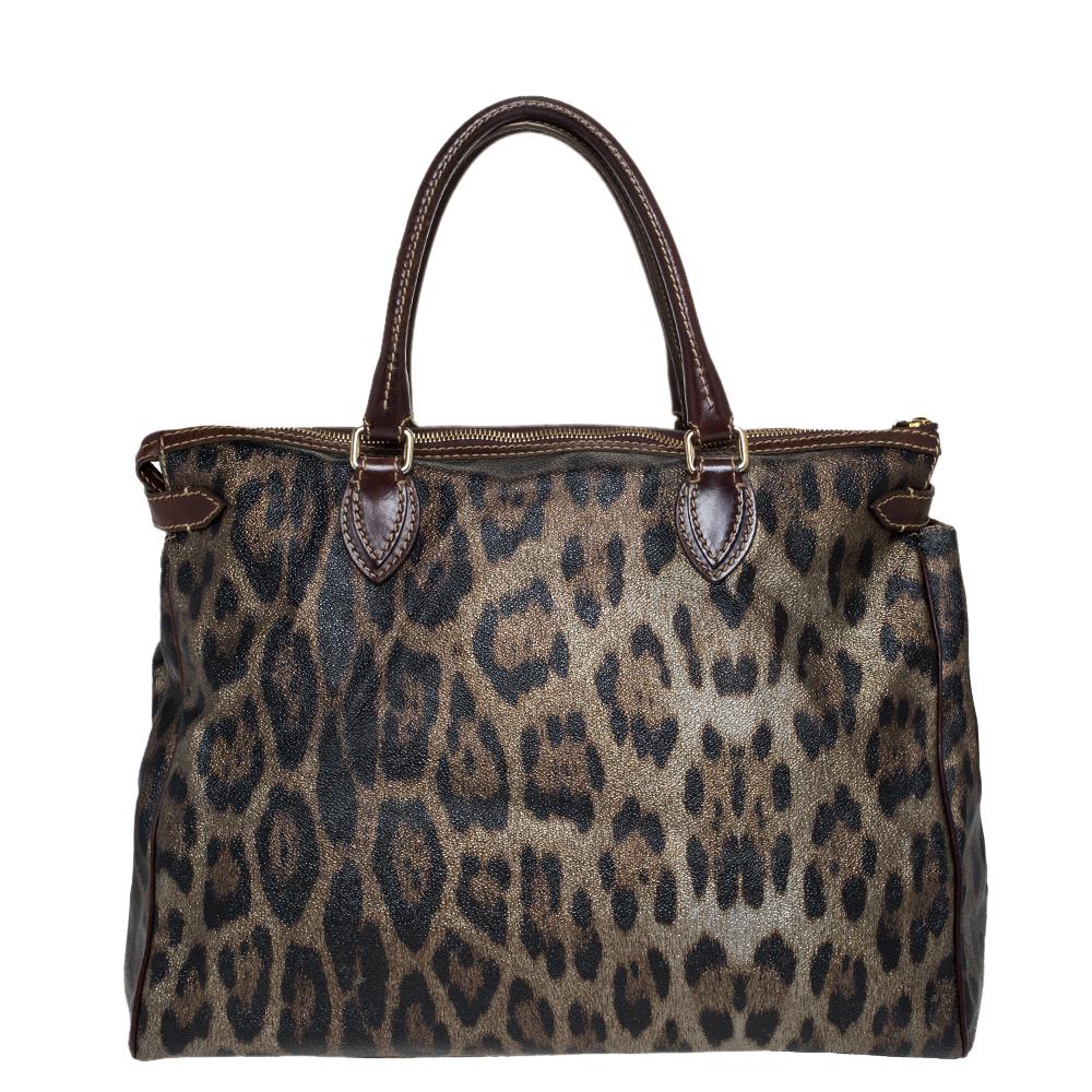 You cannot go wrong with this satchel from Roberto Cavalli. Incorporate a touch of subtle style to your look with this leopard-printed canvas and leather bag. It features a front zip logo detail and dual handles. The satchel is complete with a