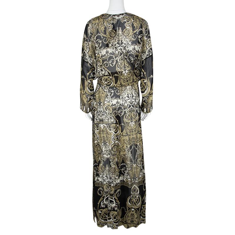 Look spell-binding in this stunner of a dress from Roberto Cavalli. Flaunting long sleeves, string detail on the waist, a V neck and metallic prints all over, the sheer maxi dress will give you a fabulous look. It can be assembled with flats or high