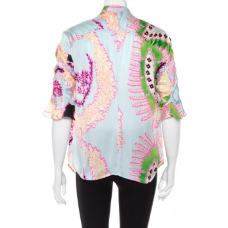 Unique, chic, and comfortable, this blouse from Roberto Cavalli is a statement piece to own. Made from silk in many hues, it is adorned with abstract prints all over and ruffle details on the sleeves for a feminine touch. Style the creation with