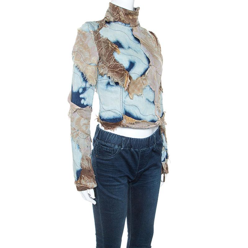 This statement jacket by Roberto Cavalli is a must-have. Crafted from an acid wash denim, this multicolored jacket makes sure that all attention is on you. It has patch detailing crafted from silk that adds interest. This short jacket has a fitted