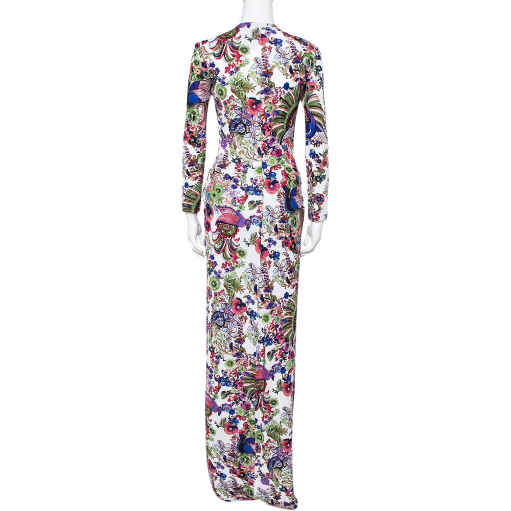 This stylish maxi dress hails from the house of Roberto Cavalli. It combines a sleek silhouette with a vibrant floral print and comes in lovely multicolored hues. It has been crafted from quality crepe fabric and has a gathered front. The maxi dress