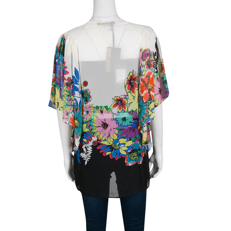 This kaftan top from Roberto Cavalli is a holiday staple; it is lightweight with a flowy structure and can be stacked in your luggage using minimum space. It has a multicolored floral print and a tie detail at the neckline. Wear this with a pair of