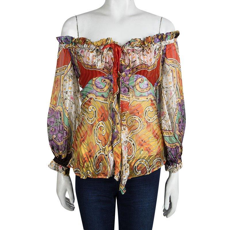 This Roberto Cavali Multicolour Printed off shoulder top features elasticated Off Shoulder ruffled neckline with long sleeves and elastic ruffled cuffs. This stylish addition to your closet with loose fitting silhouette and classic cut makes this a
