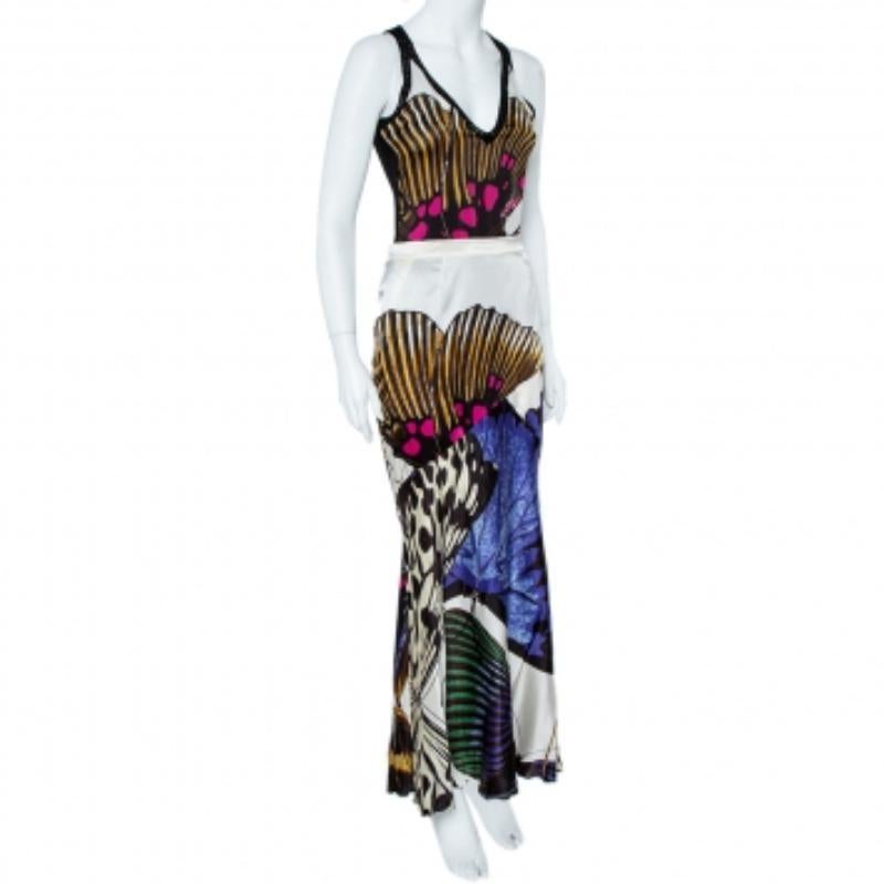 What better way to embrace summer than slipping into this amazing skirt set by Roberto Cavalli. Featuring a well-designed top with a matching long flowing skirt, this set is made from quality silk fabric with a lovely print all over.