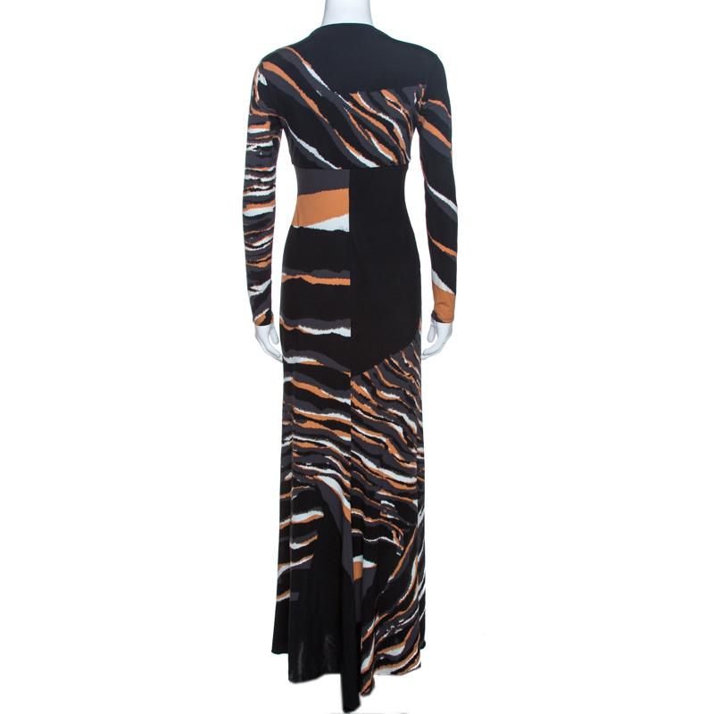 This lovely maxi dress comes from the house of Roberto Cavalli. Crafted from quality materials, it flaunts a multicolored print throughout. It is styled to deliver comfort and effortless style. It comes with a deep v-neck, long sleeves, a
