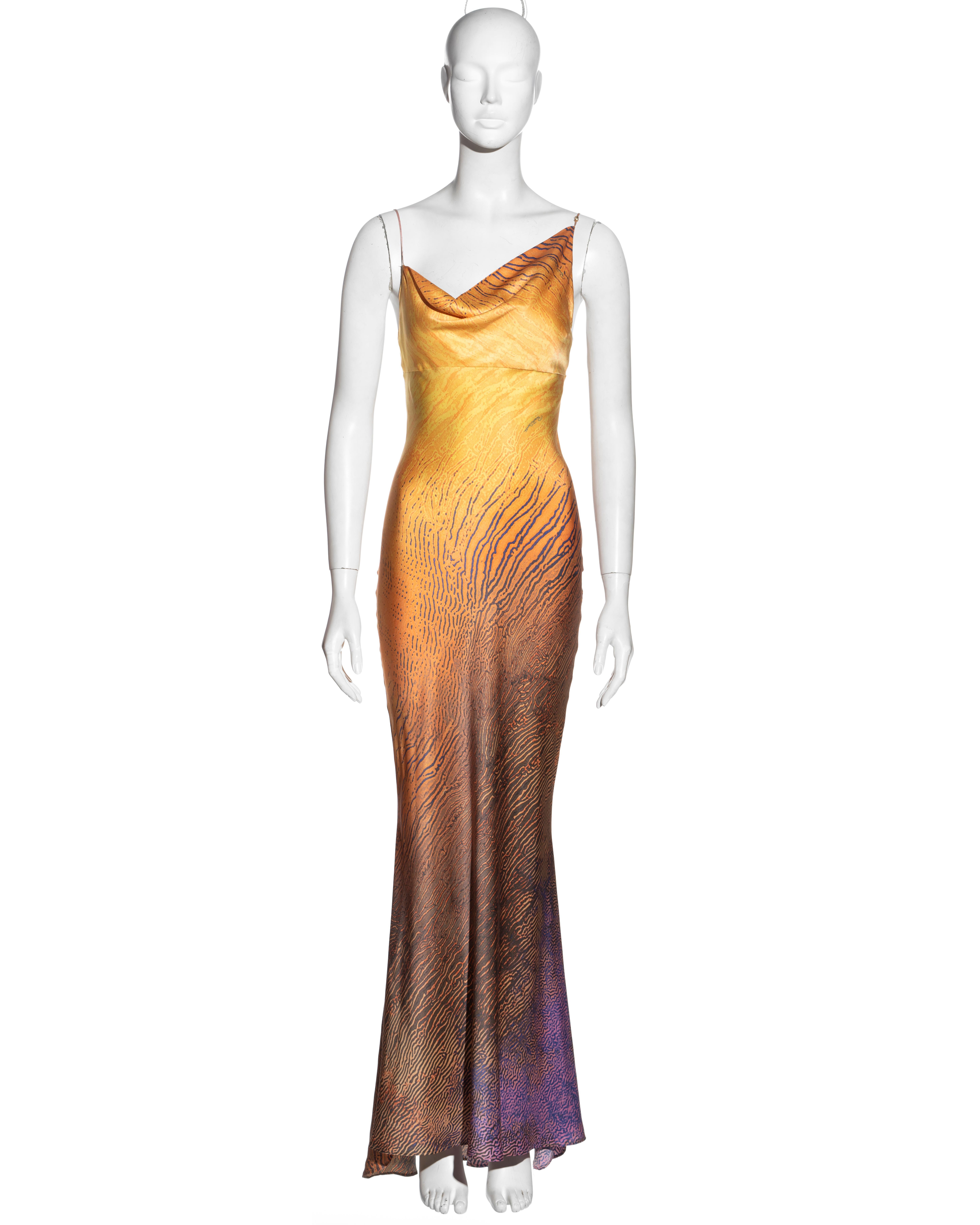 ▪ Roberto Cavalli bias cut evening dress
▪ Multicoloured sunset silk with printed graphic overlay 
▪ Asymmetric cowl neck 
▪ Spaghetti straps 
▪ Floor-length skirt 
▪ Size Small
▪ Spring-Summer 2001
▪ 100% Silk
▪ Made in Italy