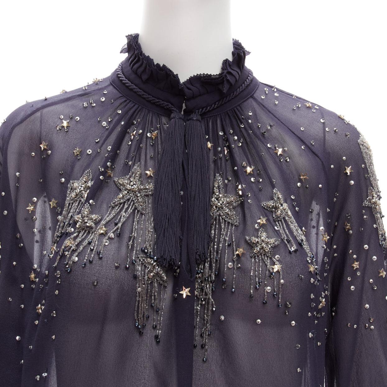 ROBERTO CAVALLI navy silky bead embellished ruffle collar sheer blouse
Reference: JACG/A00117
Brand: Roberto Cavalli
Material: Fabric
Color: Navy, Silver
Pattern: Star
Closure: Hook & Eye
Extra Details: Star motive beading also at back. Pleated