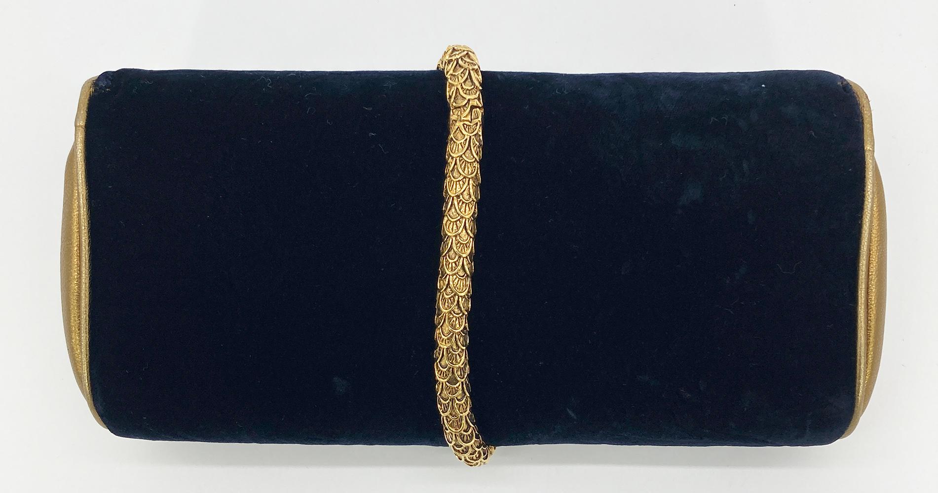 Roberto Cavalli Navy Velvet Gold Serpent Clutch in excellent condition. Navy velvet trimmed with metallic gold leather and gold metal snake embellished with tiny rhinestones. Velvet as a subtle rose embossing visible at certain angles and up close.