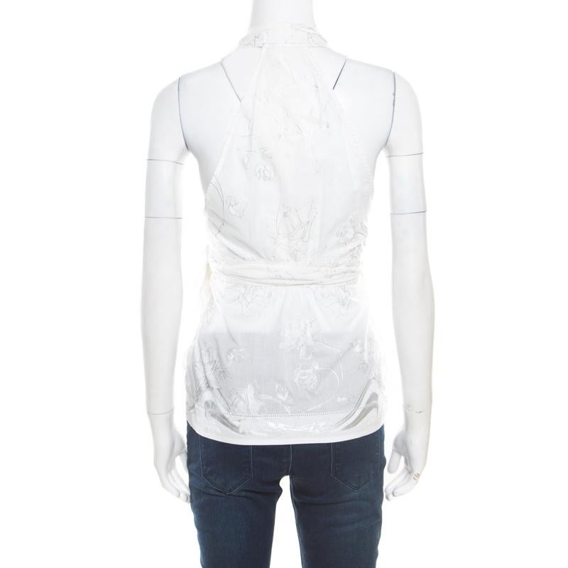 Roberto Cavalli's top is fashionable as well as comfortable. It is crafted in a wrap style with tie detail at the front that looks flattering on all body types. The off-white printed top is crafted from cotton in a sleeveless design and will look