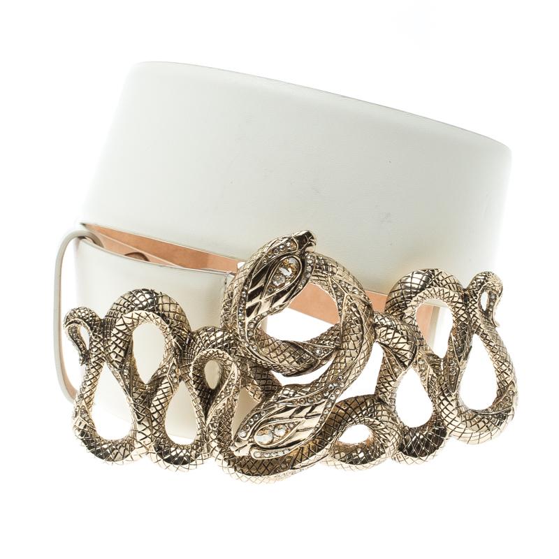 Accessorise right with this belt from Roberto Cavalli. It has been crafted in Italy from off-white leather and styled with a serpent buckle in gold tone. This piece will make a great buy.

Includes: Original Dustbag

