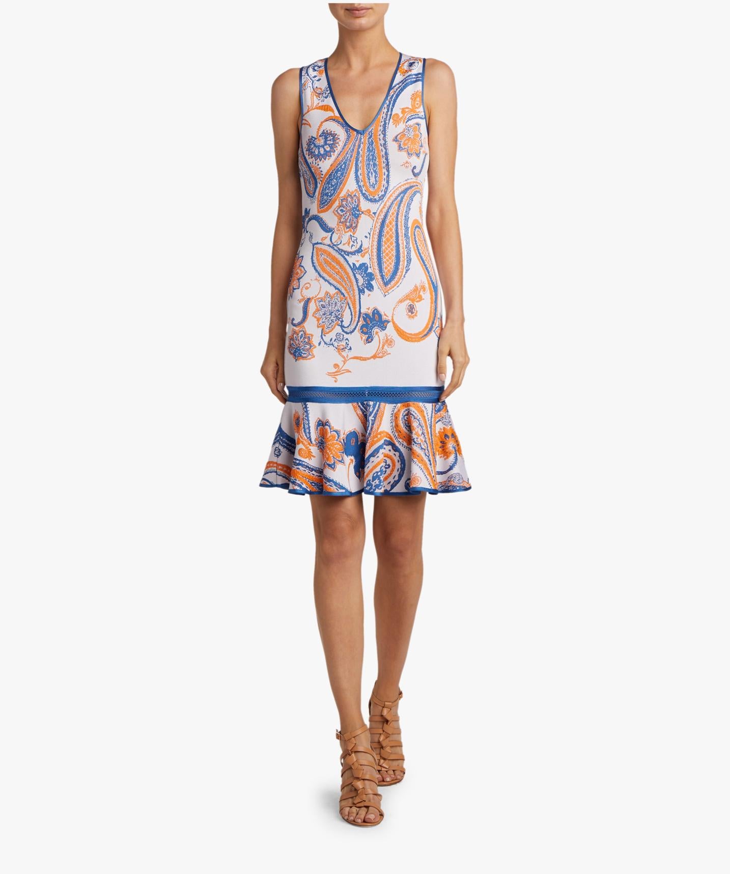 This Roberto Cavalli sleeveless cocktail dress features a vibrant orange and blue paisley print, a V-neckline, and a fitted silhouette with a trumpet hem. It is the perfect dress for a special occasion, day or night. Brand new with tags. Made in