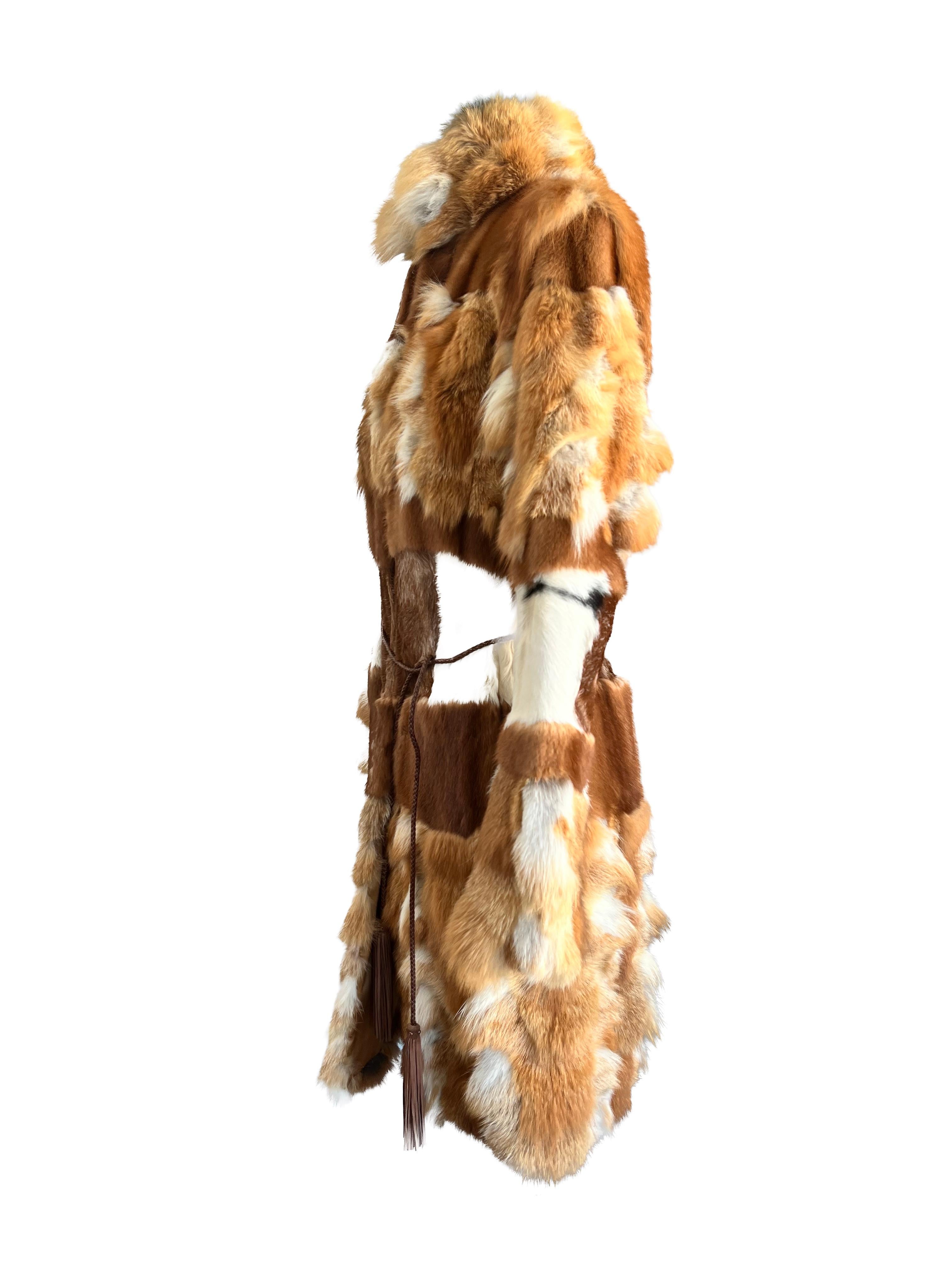 Indulge in opulent luxury with the Roberto Cavalli Patchwork Fox Fur Coat, a true masterpiece that fuses artisan craftsmanship with high-end fashion. This coat is a striking testament to Roberto Cavalli's dedication to bold designs and exquisite