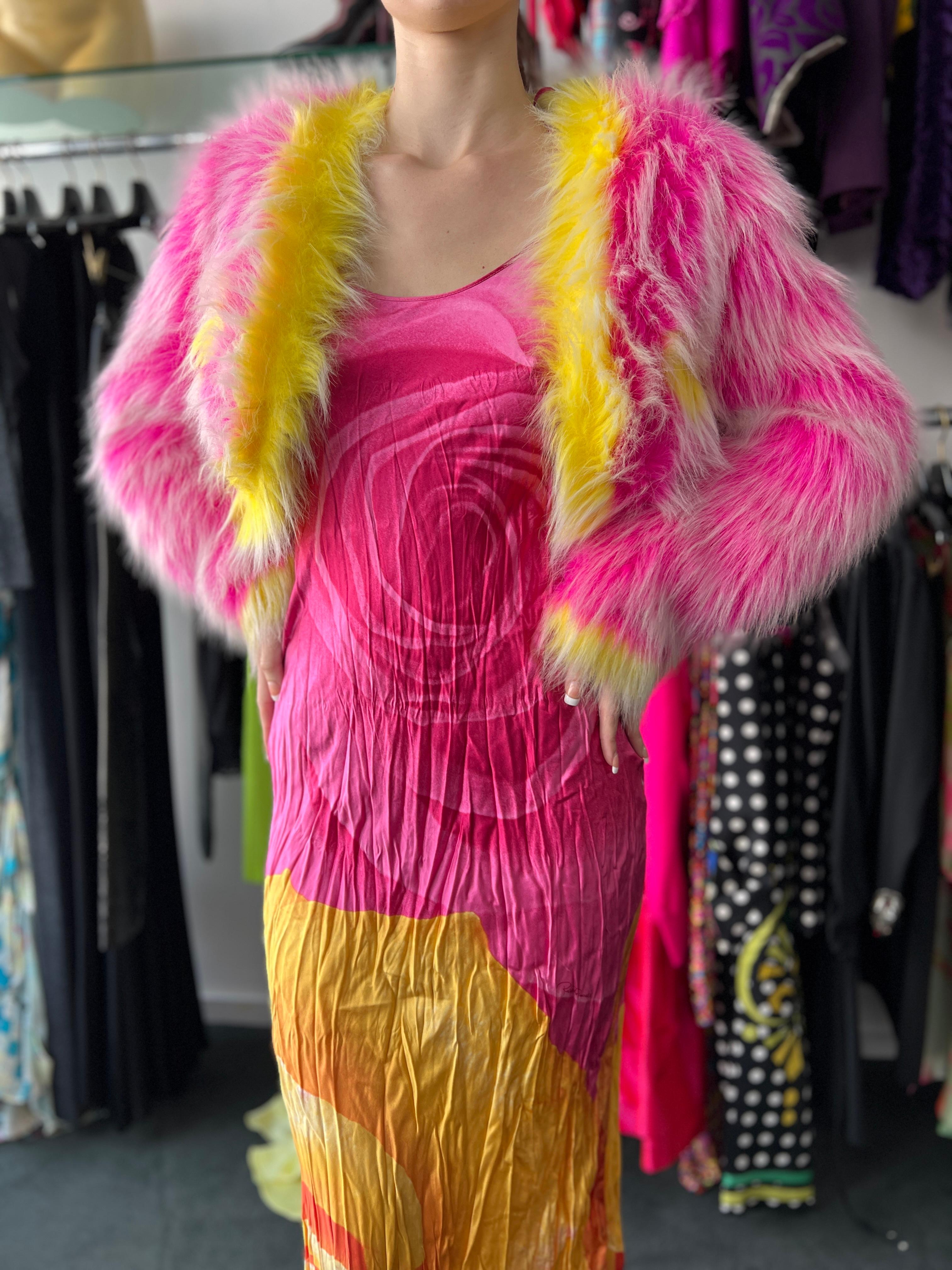 Resurrection Vintage is excited to present a vintage dress from Roberto Cavalli's iconic 2000 collection. The pink and yellow slip dress features Cavalli's iconic rose print, Fortuny-like crinkle texture, thin ties with gold hardware, and an
