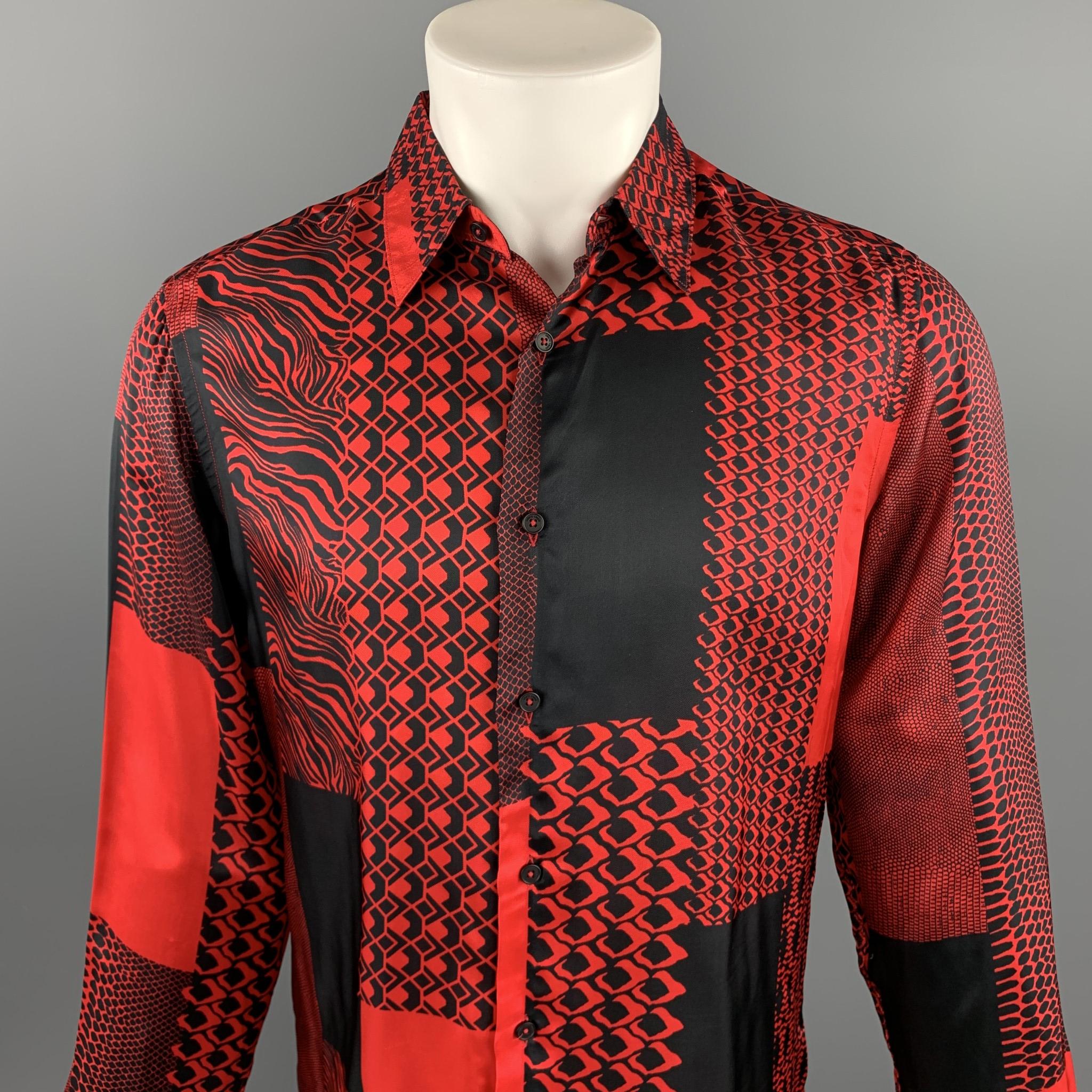 ROBERTO CAVALLI Pre-Fall 2018 long sleeve shirt comes in a red & black viscose with an all over abstract print featuring a button up style and spread collar. Minor tears. As-Is. Made in Italy.

Very Good Pre-Owned Condition.
Marked: IT