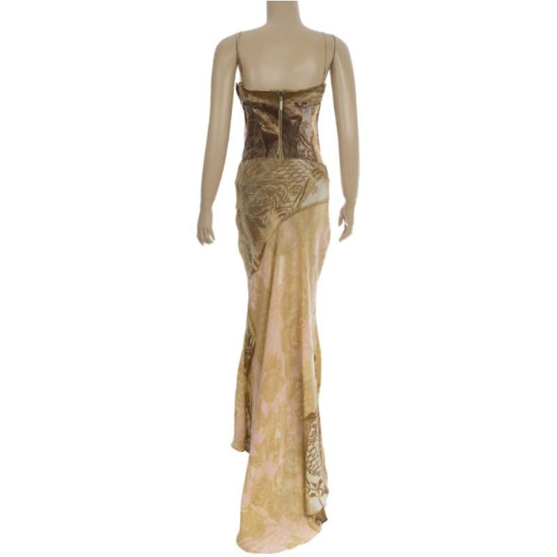 This stunning Roberto Cavalli Printed Corset Bustier Maxi Dress is absolutely fabulous! It features a bustier top, a Maxi skirt, and elegant Cavalli prints in shades of gold, highlighted with baby pink. Its skirt also drapes at its back, adding to