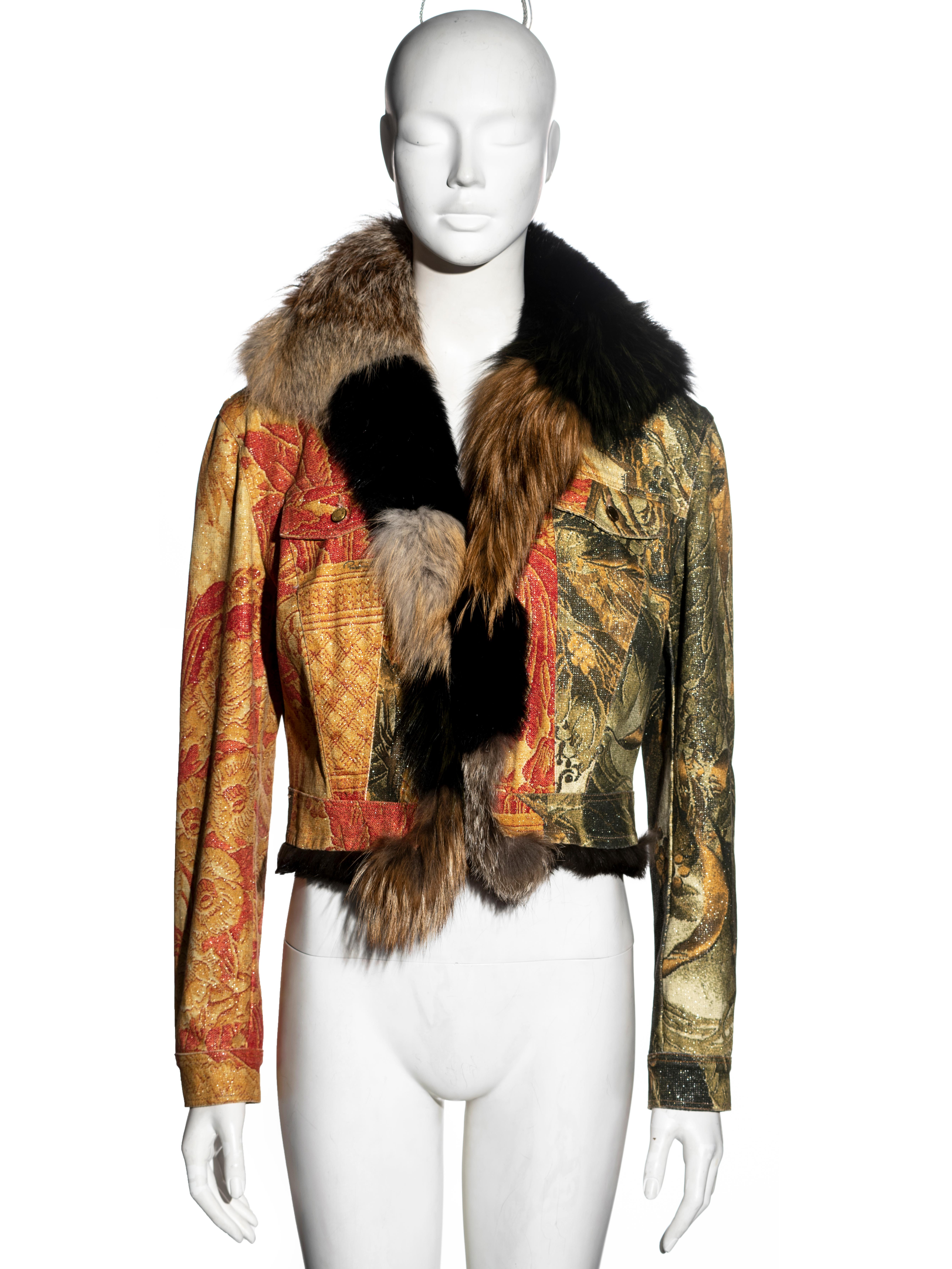 ▪ Robert Cavalli printed jean jacket
▪ Montage print in brown, red and gold tones 
▪ Fox fur collar in brown and black stripes
▪ Rabbit fur interior 
▪ Size Large
▪ Fall-Winter 2001
▪ Made in Italy