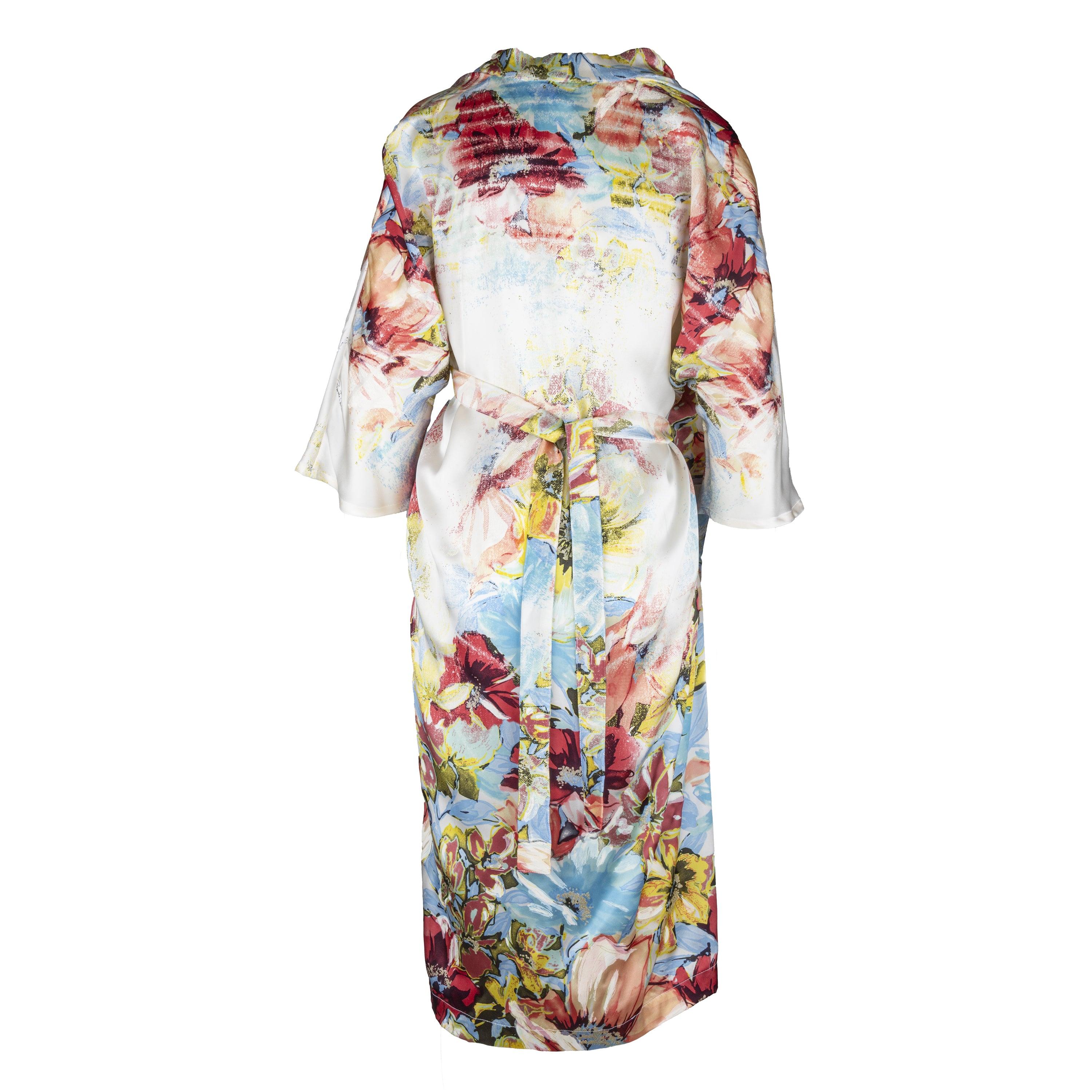 Voici la robe portefeuille en soie de Roberto Cavalli, un ajout chic et sans effort à votre garde-robe d'été. Dotée d'un superbe imprimé floral crème et multicolore, cette robe présente des imprimés floraux en coups de pinceau et des détails