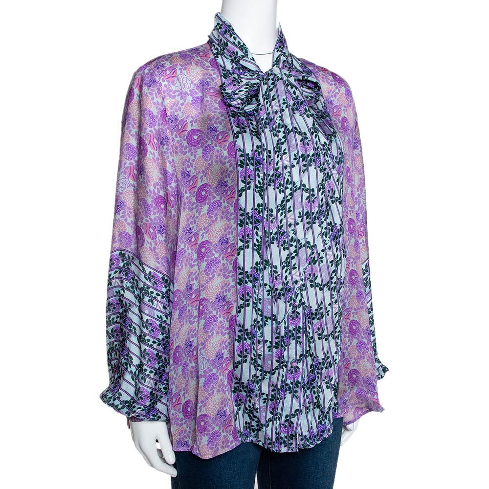 This stunning blouse comes from the house of Roberto Cavalli. Crafted from silk, it features floral prints throughout. The blouse has a tie detail at the neckline and comes with a sheer effect and a loose fit. It is just right to deliver a chic look